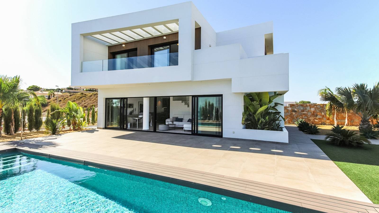 Luxury living on the Costa Blanca: modern villa with 3 bedrooms, large swimming pool and tropical garden for sale.Discover this spectacular modern villa on the sunny Costa Blanca, Spain, available to move into immediately. Set on an extensive plot of 530 m², this contemporary designed property offers everything you need to enjoy Mediterranean living to the full. The villa is for sale fully furnished, allowing you to enjoy your new home from day one.With three spacious bedrooms and three elegant bathrooms, this villa guarantees comfort and privacy for you and your guests. Each room has been meticulously designed with high quality materials and modern finishes, creating a harmonious and luxurious living environment (one of the bedrooms is located on the ground floor, with an en-suite bathroom).The real highlight of this property is its stunning private swimming pool, ideal for relaxing and enjoying a refreshing dip on warm summer days. The surrounding garden offers ample space to relax, sunbathe and enjoy the outdoors. There are also perfect areas for outdoor entertaining, so you can spend long summer evenings with family and friends.The villa is located in a quiet and safe area, with easy access to beautiful beaches, shops, restaurants and all the amenities that the Costa Blanca has to offer.For golf enthusiasts: The prestigious La Marquesa golf course in Ciudad Quesada is less than 2 km from the villa.Don't miss this unique opportunity to acquire a luxury villa in one of Spain's most desirable regions. Contact us today for more details or to arrange a viewing.