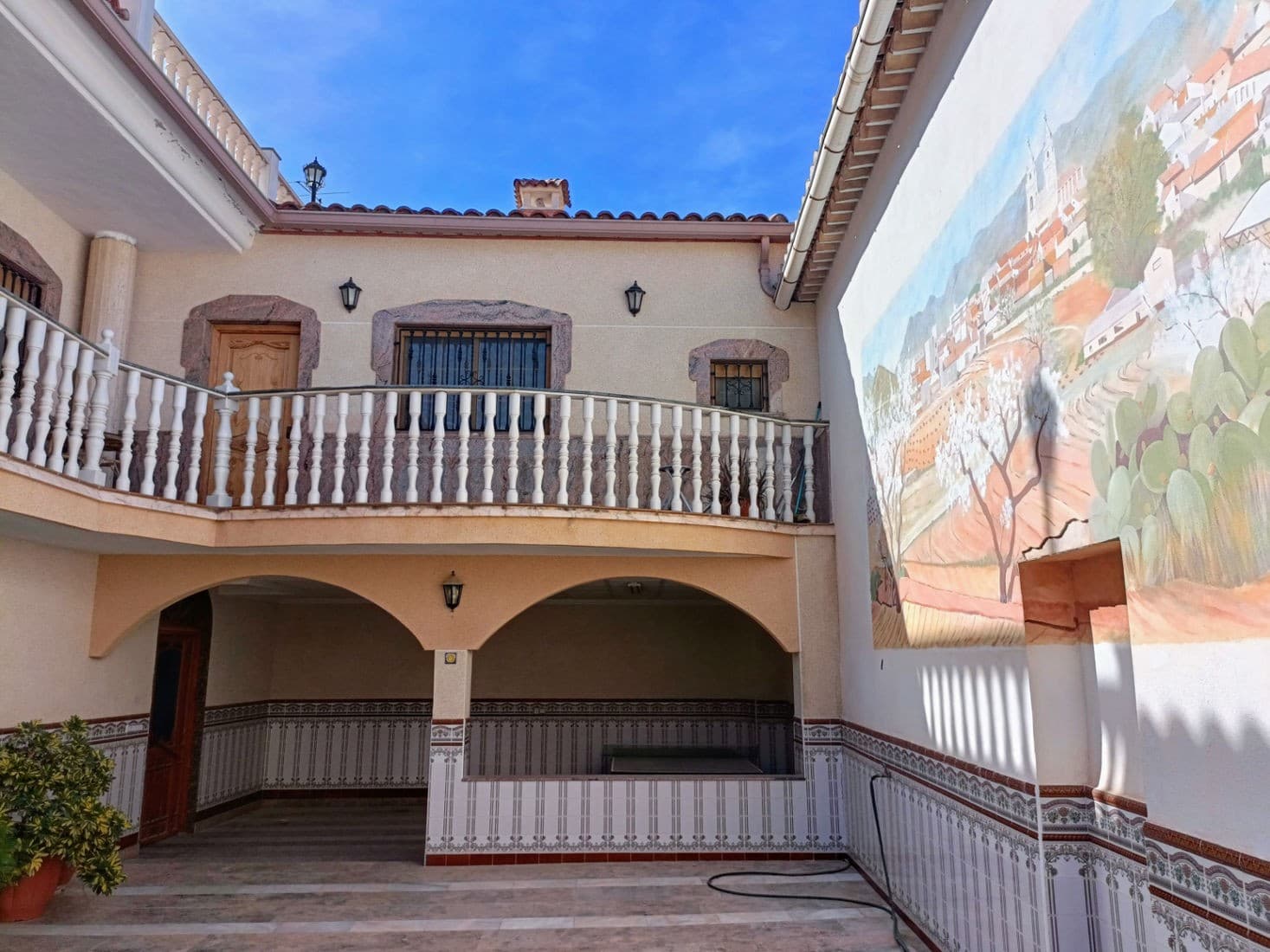 Charming traditional Spanish house in picturesque Alguena, Costa Blanca.

Do you dream of a unique house in Spain, full of charm? We have something special for you!

We are pleased to offer you a beautiful Spanish house that impresses with its patio, beautiful large rooms, and marble stairs.

This is a perfect place for a large family where tradition can meet modernity!

The house offers 2 beautiful living rooms.One living room is connected to the open kitchen and can be used as a dining room. These two rooms are the heart of the house, where the whole family will meet at the table and warm up in the winter by the fireplace which will make every moment spent at home pleasant and warm.From the second living room, two balcony windows overlook the terraces.

In total, you have 5 bedrooms of which 2 bedrooms are located in the attic. These are rooms that you can also use for remote work if you would like to. The home has spacious 2 bathrooms

Additional assets of this home are the beautiful patio and a covered terrace. On the enclosed patio, your family can have a nice time and your children can play safely. You also have the option of installing a jacuzzi, creating your oasis of relaxation under the Spanish sun.

On the ground floor of the house, there is a huge room that you can use for storing and repairing motorbikes, quads, or other things.

Leaving the house becomes a real adventure! Stroll through the charming streets of Alguena. If you need to travel often, this is the perfect place - just 40 minutes from Elche-Alicante airport. And if you like local traditions, every Sunday is an opportunity to shop at the local market. There are also local shops and a bodega where you can taste the local wine.