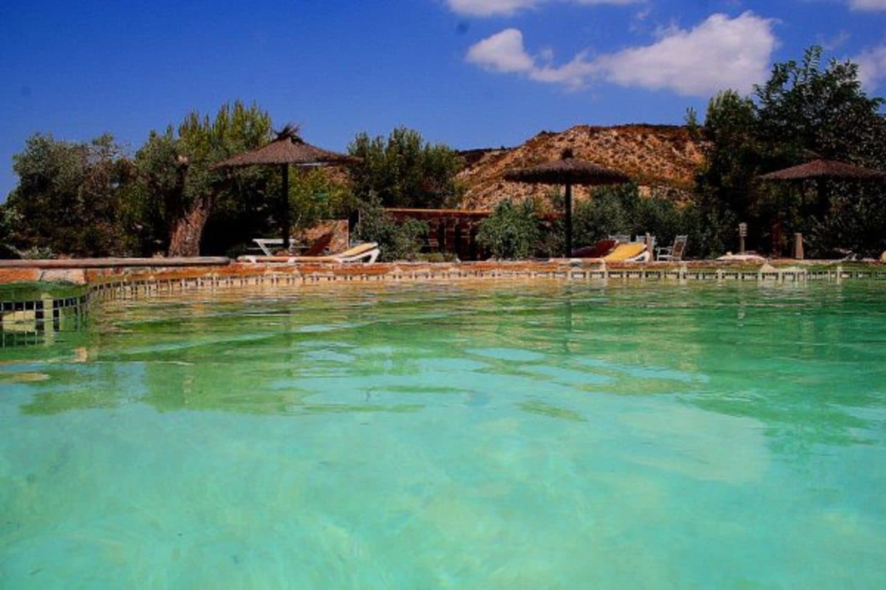 Magnificent Estate in the Sierra de Columbares Natural Park, Gea y Truyols for sale. Nestled in the heart of nature, this property enjoys an idyllic setting with spectacular views of the valley and surrounding mountains.The estate comprises 22,364 m2 of land, located just 25 km from the beach, 17 km from the center of Murcia, 25 km from the new Corvera Airport, and close to several golf courses. The property comprises 284 m2 of built area, including the main house, annex, tool shed, and swimming pool. Inside the finca boasts 3 bedrooms (with the possibility of a fourth in the annex) 2 bathrooms, Kitchen, Living and dining room. There are many extras including heating, air conditioning, solar-powered water system, five water shares, and reverse osmosis filtration.Outdoor there is a fabulous 9x12m swimming pool, bar area, sauna, spa, and outdoor kitchen with barbecue.The huge 22,364m2 plot is fully fenced with a private road monitored by security cameras.