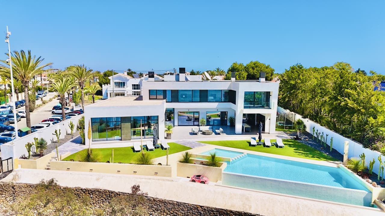 A true jewel of the Mediterranean, just listed and already turning heads in the luxury property world. The newly available beachfront villa, located in the prestigious enclave of Cabo Roig, Costa Blanca South, is not only front line to the shimmering sea — it was personally designed and built by a well known property tycoon as his private Spanish retreat.Touted as the most exclusive villa in the region, the property offers a rare combination of architectural brilliance, breathtaking panoramic views, and unparalleled privacy. With direct access to the beach and set against the backdrop of the Mediterranean coastline, this estate stands as a testament to Maher’s vision of opulence and serenity.The villa features expansive living spaces, state-of-the-art amenities, and luxurious finishes throughout. Floor-to-ceiling glass windows invite natural light and open up uninterrupted sea views, while the outdoor living areas — including an infinity pool, landscaped gardens, and multiple terraces — are crafted for both relaxation and sophisticated entertaining.“This is not just a property — it’s a once-in-a-lifetime opportunity to own a piece of Cabo Roig history” where no expense has been spared in creating a sanctuary that embodies both modern luxury and Mediterranean charm.”The villa has been finished with a super luxurious eye to detail with life access and an independent guest annex.