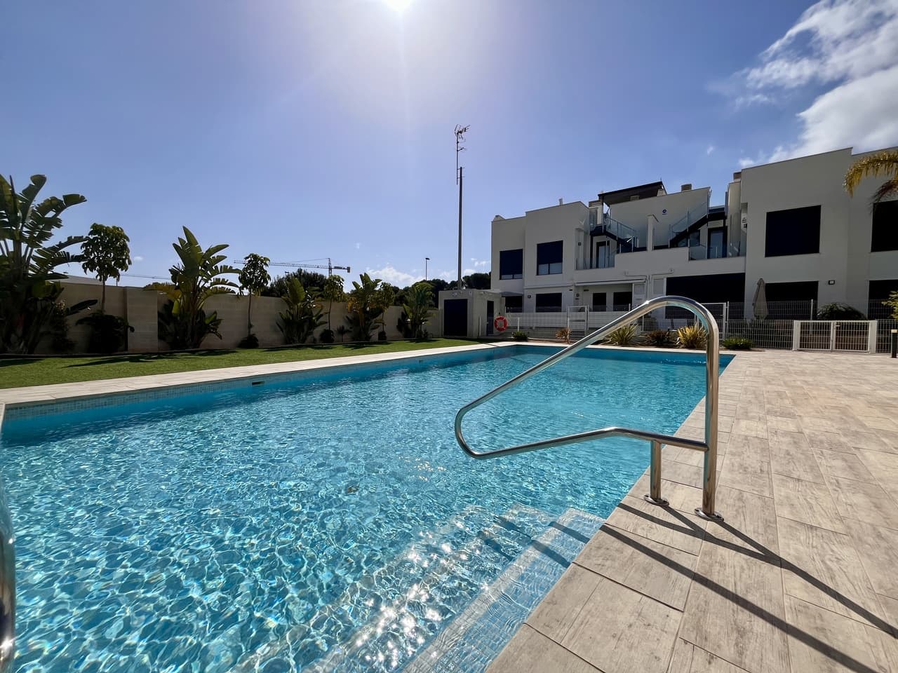This beautifully presented key-ready ground floor apartment is a fantastic opportunity that simply can’t be missed. Featuring 3 spacious bedrooms and 2 stylish bathrooms (including one en-suite), this home offers both comfort and convenience in a modern setting.The property boasts hot and cold air conditioning, electric blinds in every room, and an open-plan kitchen complete with a sleek American-style island and all-new appliances—ideal for modern living and entertaining.Enjoy the best of outdoor living with two private terraces, one at the front and one at the back, so you can choose between sun or shade at any time of day. Step outside and you’ll find a beautiful communal pool perfect for cooling off and relaxing.Located in a quiet and well-connected area of Santiago de la Ribera, this property is just a 5-minute drive to the stunning Mar Menor beaches and the popular Dos Mares Shopping Centre, which offers a wide range of retail stores, bars, restaurants, a cinema, and even a bowling alley.With schools nearby, this apartment is ideal for families, while the beachside setting and modern features also make it a perfect holiday home or investment opportunity.Santiago de la Ribera is a charming coastal town known for its relaxed atmosphere, traditional Spanish charm, and beautiful promenade lined with palm trees. Whether you’re looking for a permanent home or a sunny escape, this location truly offers the best of both worlds.