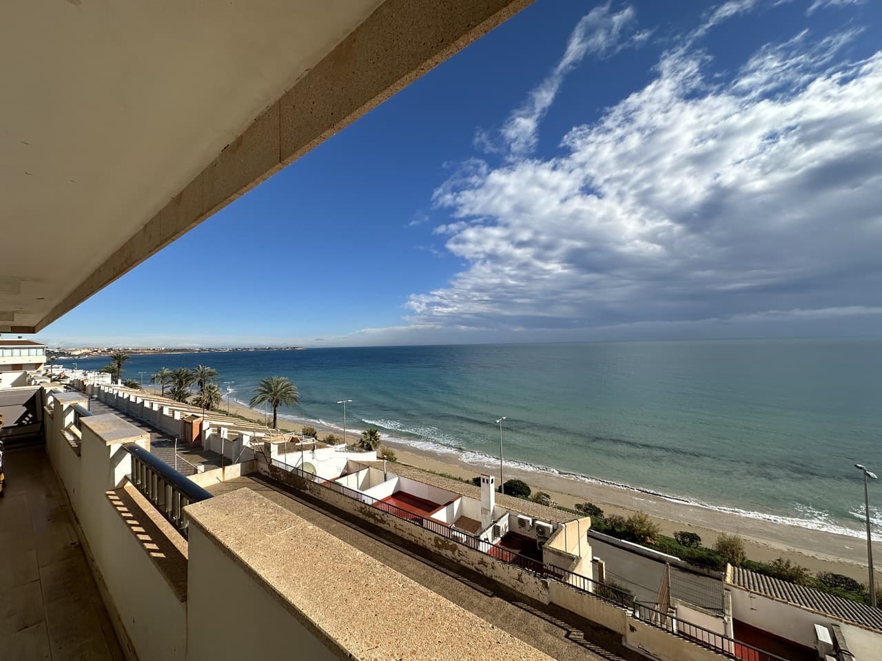 FRONTLINE, STUNNING SEA VIEWS! We are proud to present a beautiful, renovated frontline apartment located in Mil Palmeras, renowned as one of the finest beaches on the coast. The apartment is located on the second-floor, features three bedrooms, two bathrooms, and a bright, open living/dining area, and a fully fitted kitchen. The livingroom area opens onto a large terrace, offering beautiful views of the sea. The property comes fully furnished and includes air conditioning and elevator access. It is located within a secure, enclosed community to ensure privacy. Included with the property are two private parking spaces, one in the community garage and one in the outdoor parking area. And it also has a valid tourist rental license. This property is a must see and are hard to find in the area. The area offers a vibrant strip for dining, a lot of restaurants ,bars, beach bars, shops and more. Mil Palmeras is known for its beautiful beaches, clear waters and is considered one of the best in the Orihuela costa coastline.