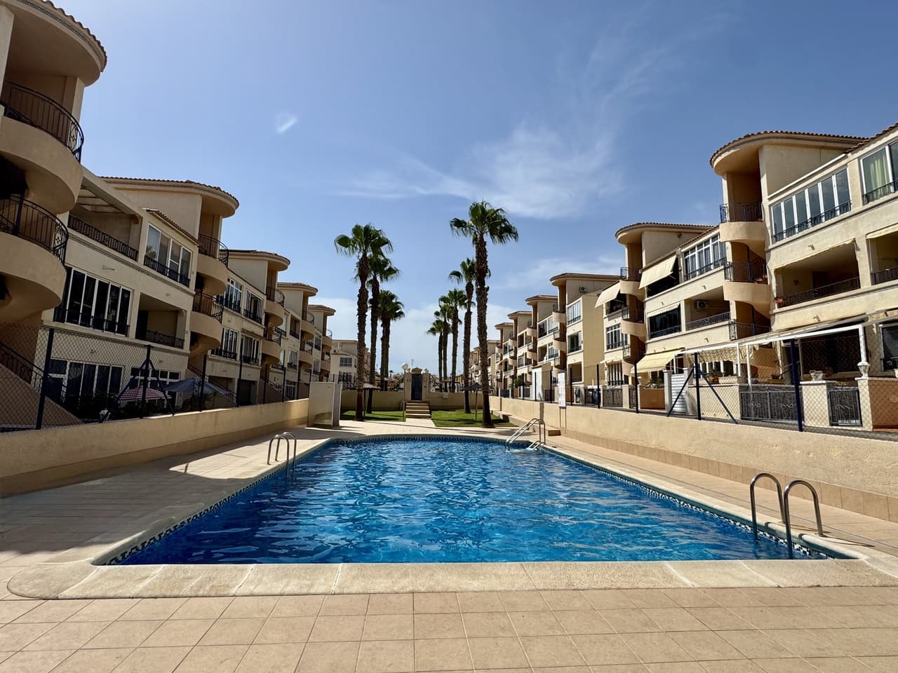 FULLY REFURBISHED immaculate apartment located just a short drive away from the beautiful Punta Prima Beach. This 1st floor property forms part of a private complex where home owners and residents can enjoy the communal swimming pool and gardens. The apartment consists of bright glazed terrace, open living and dining room, 2 bedrooms, 1 bathroom and a large kitchen with utility and storage room. The apartment has been renovated to a great standard with new flooring, modern kitchen and bathroom and is sold fully furnished, as seen. La Ciñuelica is a popular neighbourhood within easy walking distance to all amenities including the supermarket and numerous shops, bars and restaurants - a great location. This property is sold as seen, fully furnished with Air conditioning, dishwasher, washing machine, Smart TV, Fridge, Brand-new mattresses, Designer furniture, Ambient LED lighting along with Wardrobes and mirrors.Key features include:Views to green areas & pool2 communal poolsCorner unit, 1st floor – sun all dayPet-friendly area with dog park
