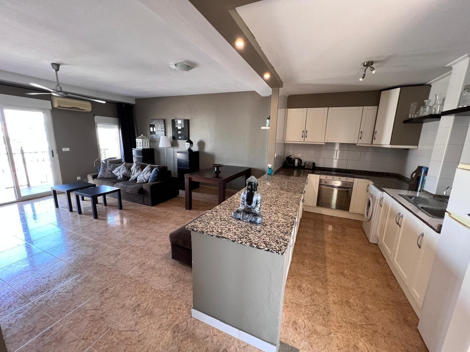 This charming first-floor apartment in San Fulgencio offers a comfortable and practical living space, perfect for either year-round living or holiday getaways. With three bedrooms and two bathrooms ( one is an en-suite bathroom), there’s plenty of room for family and guests. The apartment has an open-plan kitchen and is in overall good condition, ready for you to move in.The property comes fully furnished and includes essential home appliances. It also benefits from air conditioning, making it a pleasant retreat during the warmer months. A bright and airy layout leads to a private terrace, ideal for enjoying your morning coffee or dining outdoors. For extra space to relax, there’s also access to a rooftop solarium.Located just a 10-minute drive from the beach, 15 minutes from golf courses, and only five minutes from local shops and amenities, this home offers both convenience and lifestyle. The airport is around 40 minutes away, making it easy to travel to and from. Residents can also enjoy the use of a communal swimming pool and a reinforced entrance door adds peace of mind.This is a great opportunity to enjoy comfortable Mediterranean living in a well-connected area.