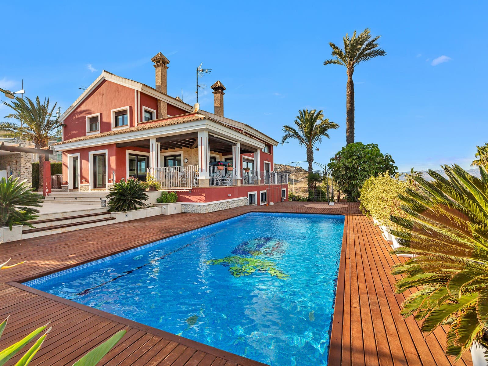 

Detached villa on the first line of the golf course in La Finca.

Discover this fantastic Mediterranean design villa in a privileged location.

Villa with 721m2 built over 3 floors on a plot of 1150m2.

On the ground floor, you will find an entrance hall and a guest toilet that lead to the spacious living room with a fireplace and views of the pool and golf course. It also has an independent kitchen and dining room. Finally, there is a spacious bedroom with an en-suite bathroom. On the upper floor, there is a large living room with access to the different rooms. On this second floor, you will find 3 bedrooms, 2 bathrooms, and 1 office with access to a large terrace overlooking the golf course. In the basement, there is a spacious bedroom, a home cinema, a pantry, a cellar, and a garage with space for 5 cars.

Extras of the house: 

Quality furniture

Under floor heating in ground floor and upper floor

Air conditioning trough all the house

10x5 m swimming pool with electric cover

50m2 barbecue area

Home automation

Video surveillance

Private entrance to the golf course

La Finca Golf is definitely among the top 3 golf courses on the Costa Blanca. The course is constantly being upgraded and improved. Both the course and practice area is in perfect condition throughout the year. The resort as a whole has also grown to become the second most exclusive resort in the area. Inside the resort you will find the impressive golf clubhouse with restaurant and bar, a 5-star spa hotel, a complete sports facility, as well as a top Italian-Mexican restaurant. 

This very special property has an extraordinary location by the green on hole 10. The property is elevated on a hill with an extraordinary and unobstructed view and over the entire resort. In front of you you have the golf course, the spa hotel and the clubhouse. The property is also the only one with its own access directly to the golf course. Here you can drive your buggy out from your own garage.