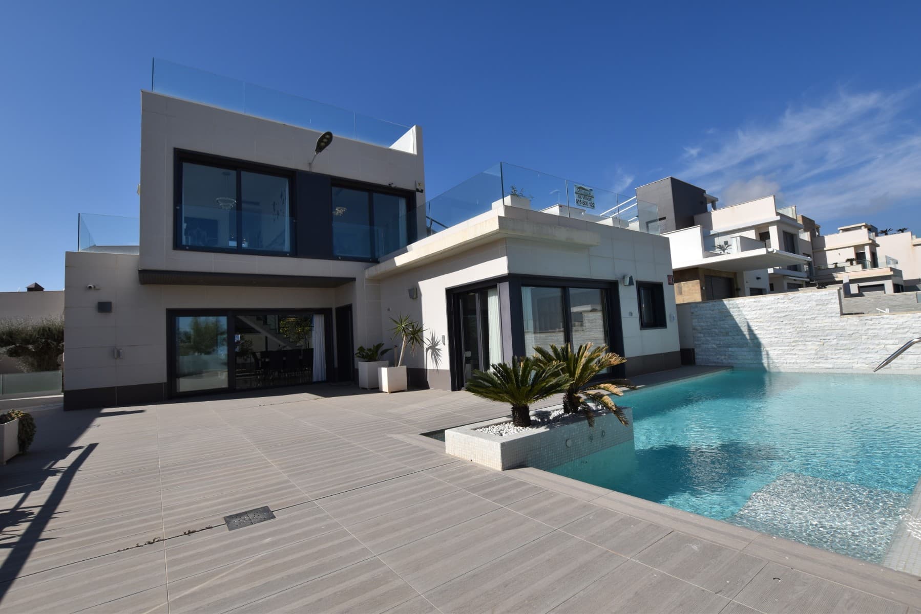 Experience luxury living in this stunning detached villa with panoramic views. Spread over three levels and connected by a private lift, it features a 298 m² layout with a private pool and cascading waterfall, creating a true oasis.



The ground floor offers a spacious living-dining area with seamless outdoor access, an open-plan kitchen, utility room, and a master suite with pool views, a large ensuite, and walk-in wardrobe.



Upstairs are two bedrooms, each with its own balcony and ensuite, plus access to a terrace and solarium via external stairs.



The expansive underbuild includes an open-plan games area, kitchen, two extra bedrooms, a family bathroom, and storage space — ideal for guests or entertainment.



Built in 2015 with premium finishes, this south-facing 430 m² plot includes private parking for three cars and combines comfort, design, and functionality.