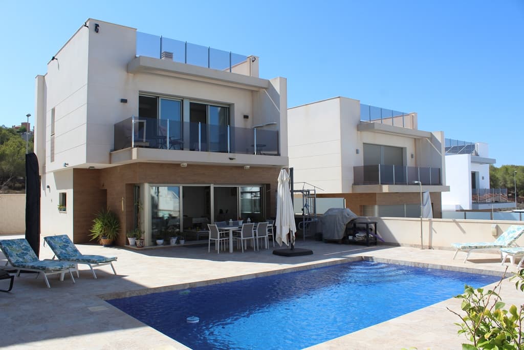 "READY TO MOVE IN" modern and stylish 3 bed, 3 en-suite bathrooms FULLY FURNISHED DETACHED LUXURY VILLA, located in the quiet location of SAN MIGUEL DE SALINAS but only 3km away from the main village with plenty of amenities and within 10km of the vibrant commercial centres, shopping malls, golf courses and the crystal clear beaches of the Orihuela Costa!Coming into the large plot of 388m2 there is space to park the car inside with entrance via an electric gate, it has an easy to maintain garden/terrace area (all tiled) with a lovely private pool where you can catch the sun all day and enjoy the outdoors.The house is oriented south-east and benefits from plenty of natural daylight thanks to the open spaces and large windows. The villa has a beautiful spacious open plan living and dining area and comprises of a bright lounge/dining room with a fully-fitted kitchen with quality appliances, a bedroom with ensuite bathroom downstairs, 2 bedrooms with two ensuite bathrooms with shower and a terrace with nice open views upstairs.From the second-floor there are exterior stairs that lead up to the large unobstructed 49 m2 private roof terrace. From here you have amazing views of the rural countryside, salt lakes and the Mediterranean sea. This would make a wonderful area to sit and have a BBQ or have drinks with friends or just relax with a good book and enjoy the sun all day long.At the front of the property, you have a lovely seating area that gives you access to spacious and bright living room by sliding doors that overlook the pool. The property further benefits from large wardrobes in bedrooms upstairs, floor heating in 3 bathrooms, centralized hot and cold air conditioning, electric shutters and gate. The location of this luxury villa is close to various golf courses such as Las Colinas Golf & Country Club, Campoamor Golf, Las Ramblas Golf and Villamartin Golf. With beautiful open views over the rural countryside, you are just a 10-minute drive from the beaches of La Zenia, Playa Flamenca, Cabo Roig and Campoamor, plus close to supermarkets, restaurants and the popular shopping centre of La Zenia Boulevard with 150 shops or the Villamartin Plaza.Both Airports Alicante and Corvera Murcia are respectively only a 45 minutes’ drive. This is a high quality and beautiful villa in pristine condition and we highly recommend viewing !