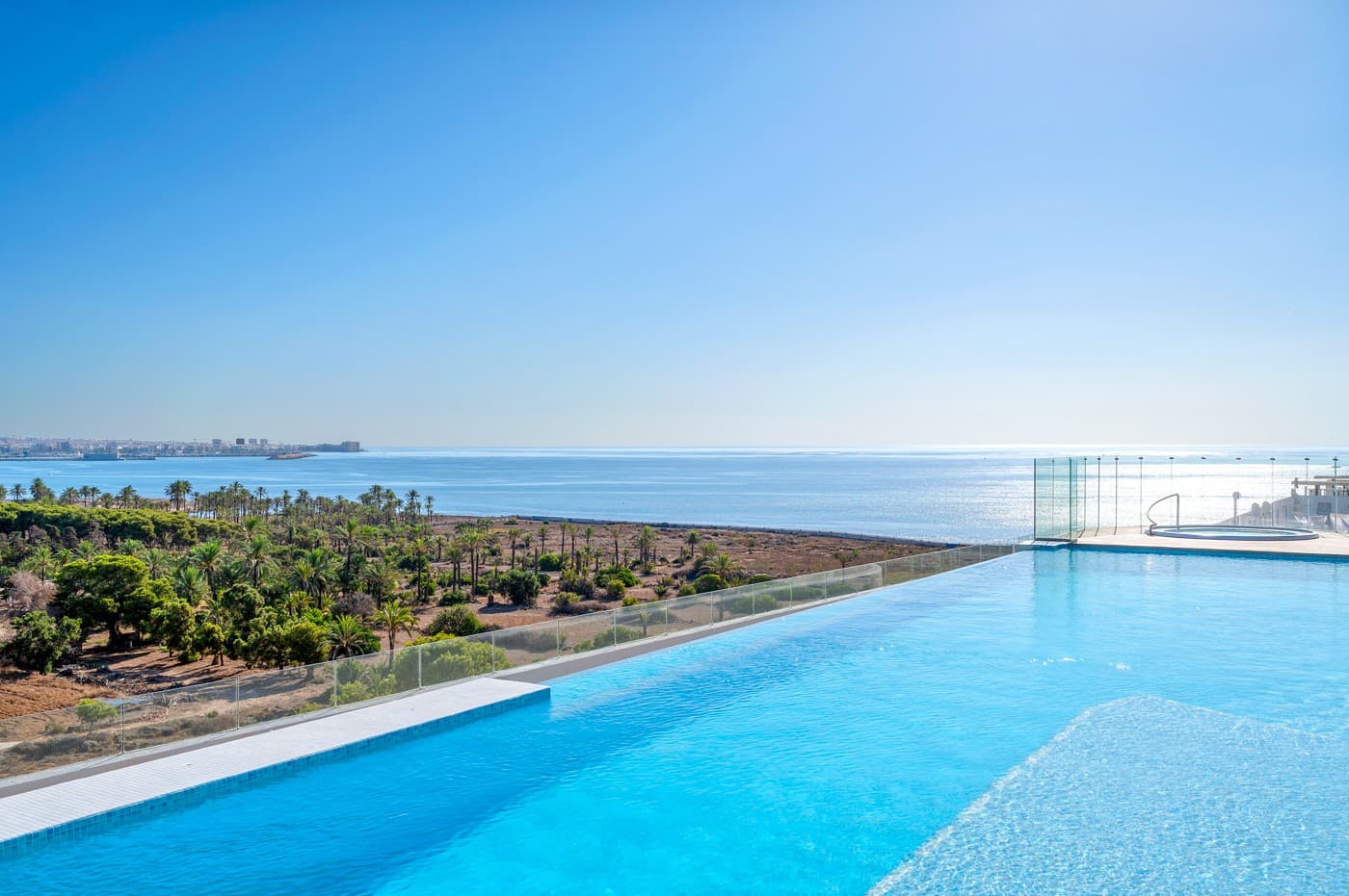 This stunning apartment, built in 2024, offers breathtaking views of the sea and the harbour of Torrevieja. Just 300 metres from the coastline and within walking distance of shops, restaurants, and all essential amenities.

The property features two bedrooms and two bathrooms, one of which is en suite. The modern open-plan kitchen is fully equipped and flows into a bright and airy living area.

Exclusive extras include a communal rooftop terrace with swimming pool, outdoor kitchen, and BBQ – perfect for stylish Mediterranean living.

An underground parking space and a private storage room are also included for added comfort and security.