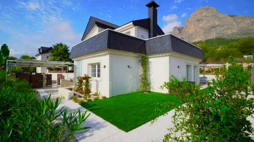 We present a stunning villa with sea and mountain views in the town of Polop.Polop is a small town on the outskirts of Benidorm, just a 20-minute drive from the beach. The town sits 200 m above sea level and is surrounded by mountains, gorges and forests. Crystal-clear mountain air, breathtaking views, excellent ecology and more than 300 sunny days a year attract people from all over the world. This area is especially popular with Scandinavians, the British and Russians, who buy property here to create their own cosy, ideal place for living and holidays. The town has a well-developed infrastructure: kindergartens, schools, shops, supermarkets, bars, restaurants, a sports complex with a swimming pool, etc.The house is arranged over two levels, with a total built area of 145 m² and its own plot of 500 m².The property offers three bedrooms, three bathrooms, a modern kitchen, a spacious living room, a utility/technical room and several terraces with sea and mountain views. The garden is equipped with a 30 m² illuminated swimming pool, a chill-out area with outdoor furniture, lawn, and a garden with ornamental and fruit trees and an automatic irrigation system.The price includes: furniture, a fully fitted and equipped kitchen, fully fitted bathrooms with underfloor heating, built-in wardrobes throughout the house, video intercom, split air-conditioning and heating systems, electric shutters on the windows, reinforced entrance door, outdoor lighting, security alarm, swimming pool with filtration system, and solar panels.Online purchase is possible, as well as mortgage financing from a bank at 3–6% per annum.When you buy property in Spain, you can apply for a residence permit. Our company assists in obtaining any type of residence permit.