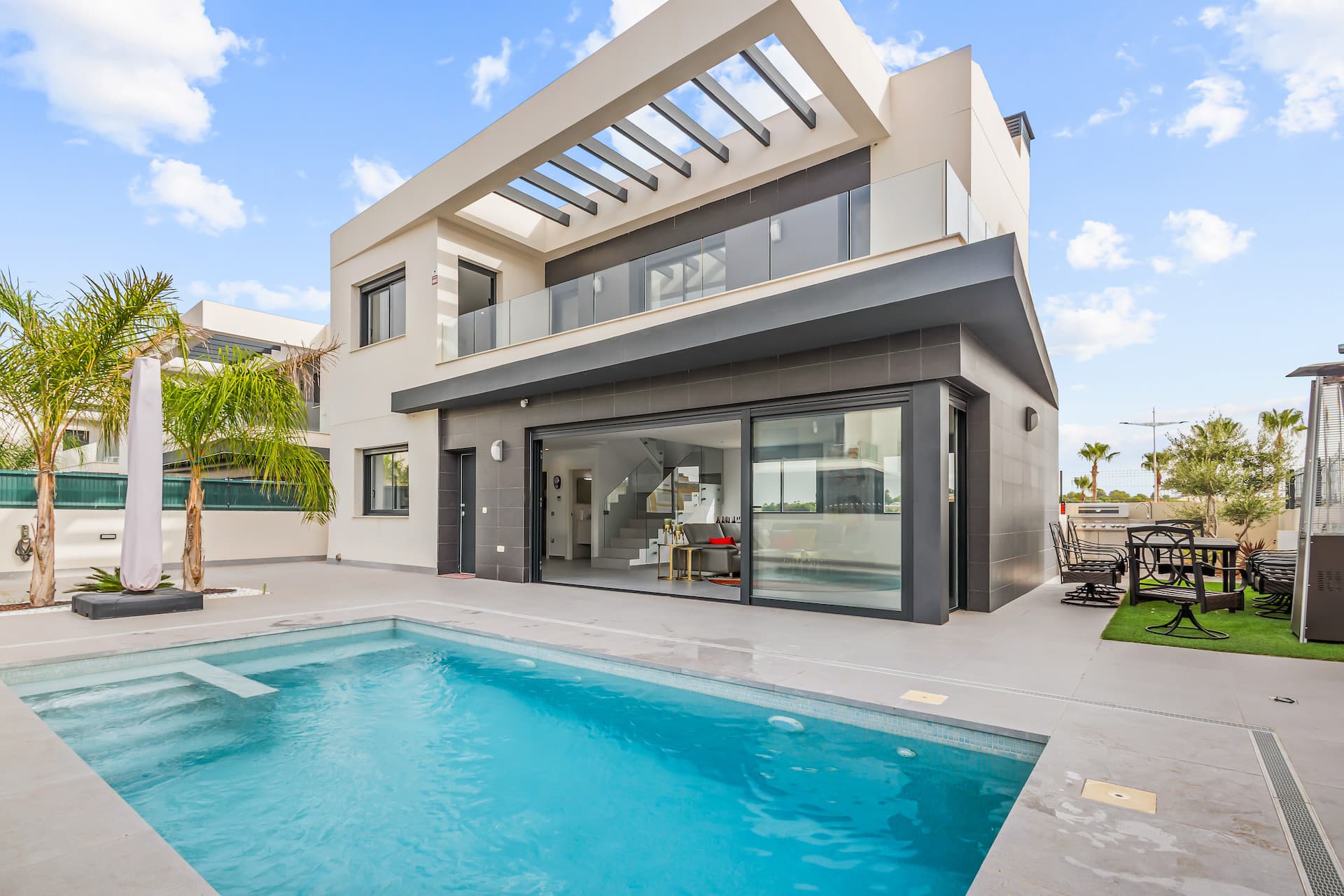 We are delighted to present to you this Fabulous Detached Villa in Algorfa! Set in an amazing area, walking distance to a commercial area, this property offers everything you need for an exceptional lifestyle in Spain. The property is accessed through an automated gate for parking the car on the plot. Right in front of the house there is a large swimming pool to enjoy the warm weather throughout the year. As you enter the main door, the large living space is flooded with lot of natural light. On the left side you have the open kitchen area fully equipped and high-quality finishes, perfect to entertain the guests. In the same area you have the utility room with the washing machine, boiler, and the dryer. On the same level, there is a toilet as well. As you go on the 1st floor you access the main bedroom and the guest bedroom, both with good size and en suite bathrooms. The same floor has a large balcony with views over the pool area.The basement was transformed into a second living space, has one bedroom and a room serves as an office. Also, there is a shower room and storage rooms.The villa is fully furnished with modern décor, and it comes with a central AC system for year-round comfort.Step outside to enjoy your private swimming pool, perfect for relaxing or entertaining friends under the sun or just enjoy a nice meal near the BBQ area.This is a property NOT TO BE MISSED! Early Visit is Advised!Algorfa is known for its peaceful surroundings, beautiful landscapes, and welcoming community. It is a popular destination for those seeking a quiet lifestyle with easy access to golf courses, shops, and restaurants.