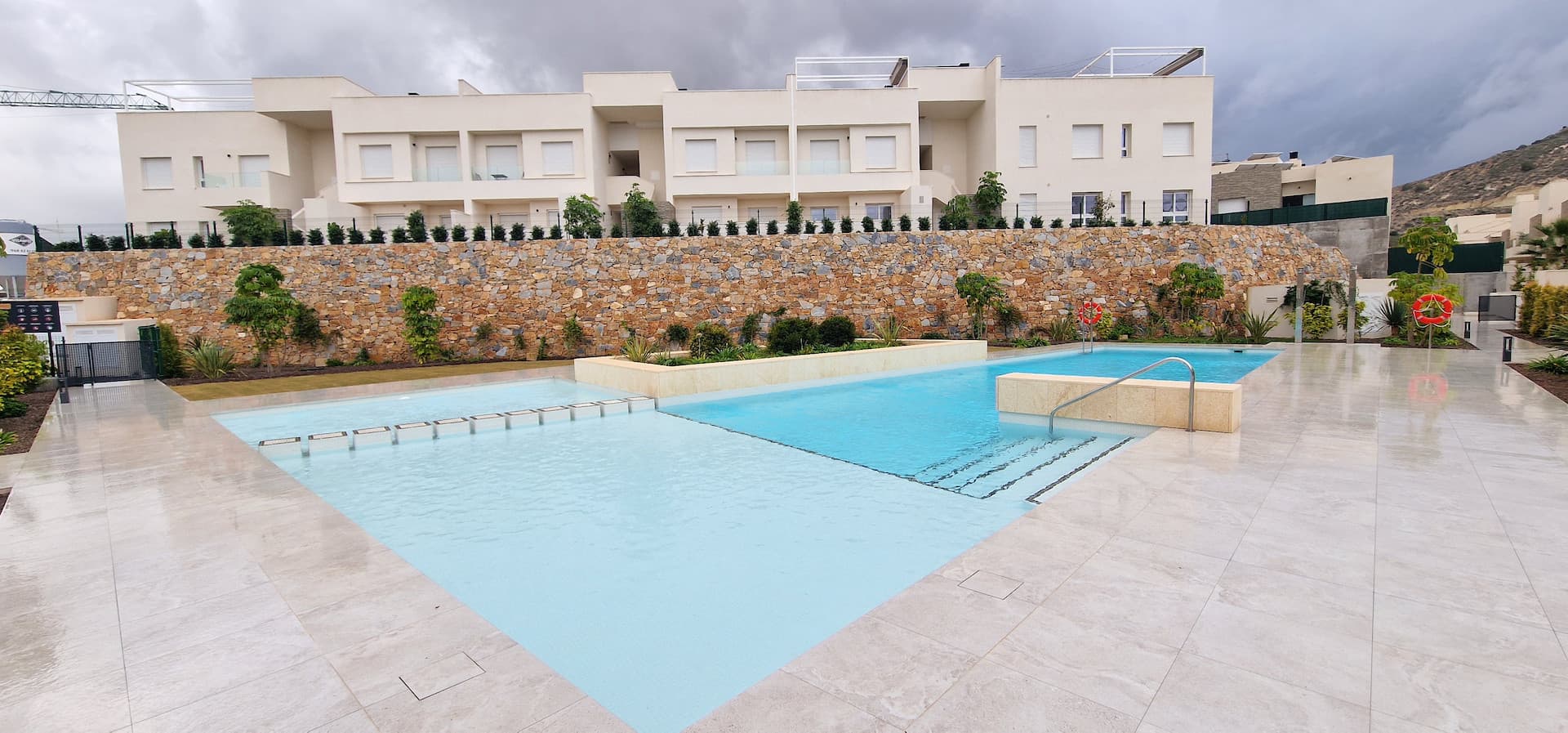 Modern and stylish, this partly furnished three-bedroom top-floor apartment with private solarium is located in La Finca Golf, one of the most desirable areas of Algorfa. Built in 2024, the property offers approximately 95 m² of well-designed interior space, combining comfort, functionality, and contemporary design.The apartment features three generous bedrooms and two modern bathrooms, including a master bedroom with en-suite, making it ideal for families, guests, or those requiring additional space for a home office. The bright open-plan living and dining area has been thoughtfully designed to maximise natural light and comfort, with high-quality finishes throughout.From the living area, you step out onto a spacious terrace, which also includes a convenient storage area on the same level. An external staircase leads to the impressive private solarium, offering fantastic open views across Algorfa. The solarium is equipped with an outdoor shower and pre-installation for an outdoor kitchen, providing the perfect setting for relaxing or entertaining.The property benefits from a large underground parking space and an additional private storage room. The building offers lift access, as well as access to a beautiful communal swimming pool and well-maintained green areas.Algorfa is renowned for its peaceful surroundings, scenic landscapes, and excellent access to local amenities. The area offers charming cafés, shops, and renowned golf courses, making it ideal for those seeking a relaxed yet active lifestyle, all within easy reach of larger towns and the stunning Costa Blanca beaches.This property is a turnkey opportunity, with the option to purchase the furniture by negotiation, allowing for a smooth and effortless move-in. A superb opportunity to own a modern home in one of the most sought-after residential areas.Contact us today for further information or to arrange a viewing.