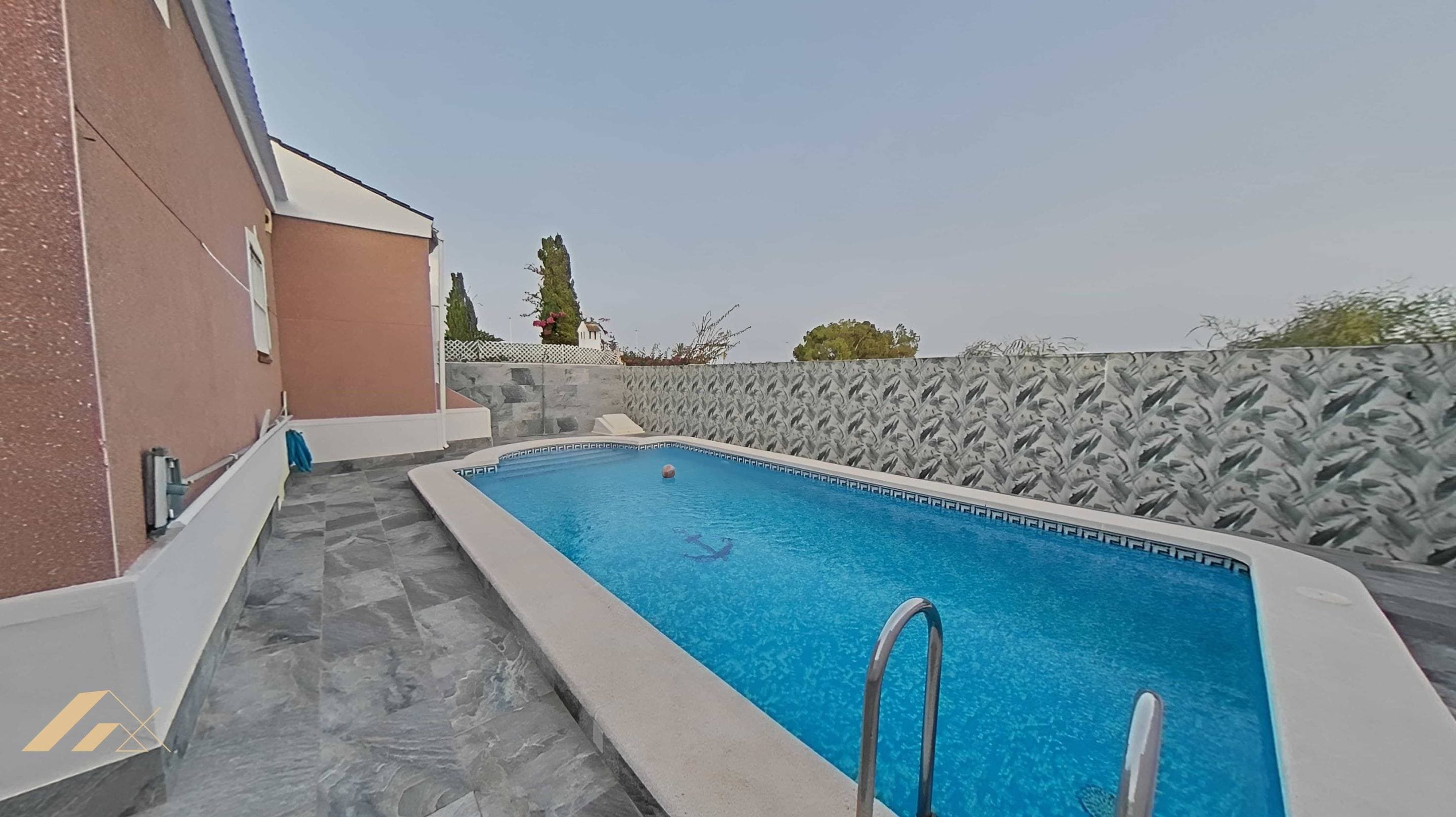 Discover this impressive property located in the quiet area of ​​San Luis, Torrevieja. Just a few meters from Mercadona and very close to the Las Habaneras shopping center, this villa is ideal for those seeking comfort and style in a family-friendly setting. With a constructed area of ​​145 m² and a usable area of ​​130 m², the home offers three spacious double bedrooms that provide natural light thanks to its east-west orientation, a spacious living room, and a room that could be used as an office or playroom. Enjoy the luxury of two fully equipped bathrooms, as well as an exceptional outdoor space, part of which is covered for parking or gatherings with your loved ones. A private pool is also available where you can relax during warm summer days! The plot has a total area of ​​300 m², perfect for enjoying the outdoors or even hosting small family gatherings. Additional amenities include private parking and the invaluable advantage of having exterior spaces throughout, ensuring optimal ventilation and lighting within the property. Located just eight kilometers from the Mediterranean Sea, you'll have easy access to idyllic beaches without sacrificing the tranquility that comes with living away from the hustle and bustle of the coast.