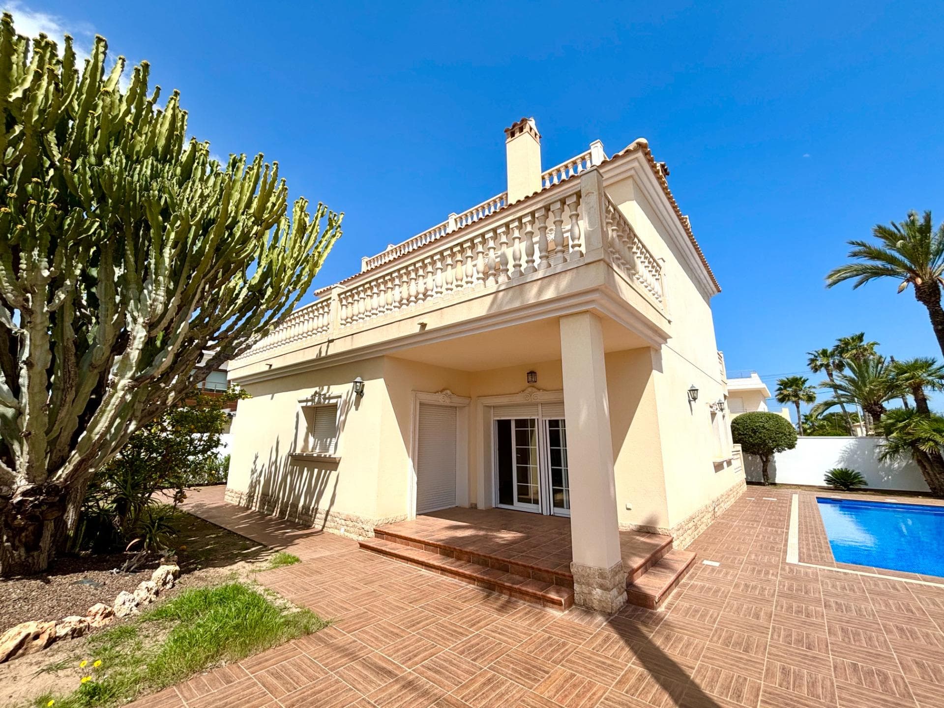 This beautifully renovated villa sits on a spacious 518 m² plot in one of Cabo Roig’s most prestigious neighborhoods, just 400 meters from the beach. Designed and finished to an exceptional standard, the property features underfloor heating in all bathrooms, full air conditioning throughout, and stylish ceramo granite flooring.  Outside, the villa offers excellent privacy with high perimeter walls, non-slip tiled surfaces, a sleek infinity pool, an outdoor shower, and a brick-built storage room. There is secure off-road parking for up to three vehicles, with ample space to create an outdoor entertaining or dining area. Inside, the bright and inviting living room features a wood-burning fireplace with a marble surround and opens onto a terrace—perfect for al fresco meals. The fully equipped kitchen includes high-end Bosch appliances, shaker-style cabinetry, granite countertops and splashbacks, and direct access to the garden—ideal for adding an outdoor kitchen. ' A flexible ground floor room serves perfectly as an office, dining area, or additional bedroom, complete with air conditioning and pre-installed communication cabling. The stylish ground floor bathroom is tastefully tiled and features underfloor heating, a walk-in shower, bidet, toilet, and modern vanity. An additional bedroom also provides air conditioning and access to a private balcony. On the first floor, three en-suite bedrooms each offer their own private balcony, air conditioning, and contemporary bathrooms with walk-in showers or bathtubs, bidets, underfloor heating, and elegant vanity units.  The second floor features a sunny, secluded solarium with sea views, stone balustrades, and tiled flooring—an ideal space for relaxing or entertaining. All fittings and finishes throughout the home are brand new and of the highest quality. This is a rare opportunity to acquire a turnkey luxury villa in one of the Costa Blanca’s most desirable coastal locations. Contact us today to schedule your private viewing