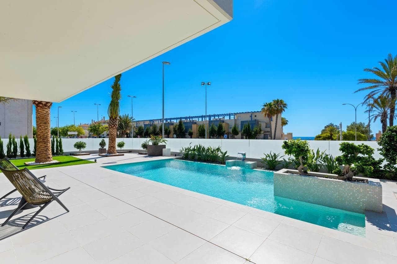Discover your dream villa in Campoamor  Welcome to this stunning luxury villa, designed to offer maximum comfort and an exclusive lifestyle. Every detail has been carefully thought out to create a sophisticated and welcoming atmosphere.  Just 250 meters from the AguaMarina Beach. Key features: - Sea View - Integrated Smart Home system. - 4 double bedrooms with en-suite bathrooms. - Master bedroom with bathtub, shower, and toilet. - Underfloor heating and high ceilings. - Built-in Siemens appliances: coffee machine, oven, extractor, ceramic hob, and American fridge. - Ducted air conditioning with room-by-room control - High ceilings and plenty of natural light - Built-in Siemens appliances: coffee machine, oven, extractor, ceramic hob, and American fridge - Designer furniture and high-quality finishes - Beautiful private garden with palm trees, flowers, and greenery - In perfect condition - Within walking distance to supermarket, pharmacy, beach, and restaurants - Alarm system with video surveillance  Impressive outdoors: - Private 50-square-meter pool. - Beautiful garden, BBQ area, and outdoor sports area. - Spacious terrace and solarium with sea views. Contemporary design:  The bathrooms are equipped with high-quality materials to ensure maximum comfort. The interior combines designer furniture with premium finishes, creating a warm and sophisticated environment. The spacious living room, filled with natural light, is perfect for family gatherings or moments of tranquility. The modern, fully equipped kitchen offers everything needed to enjoy home-cooked meals with complete comfort. Privacy and security:  The villa has private parking and is located within an exclusive residential complex, ensuring a peaceful and secure environment for your family. Prime location:  Located in one of the best areas of Campoamor, enjoy the sea and beautiful beaches whenever you wish. This property offers the perfect balance of luxury, comfort, and location. Don’t miss the chance to visit this exceptional villa and discover for yourself everything it has to offer. Contact us today for more information or to schedule a visit.