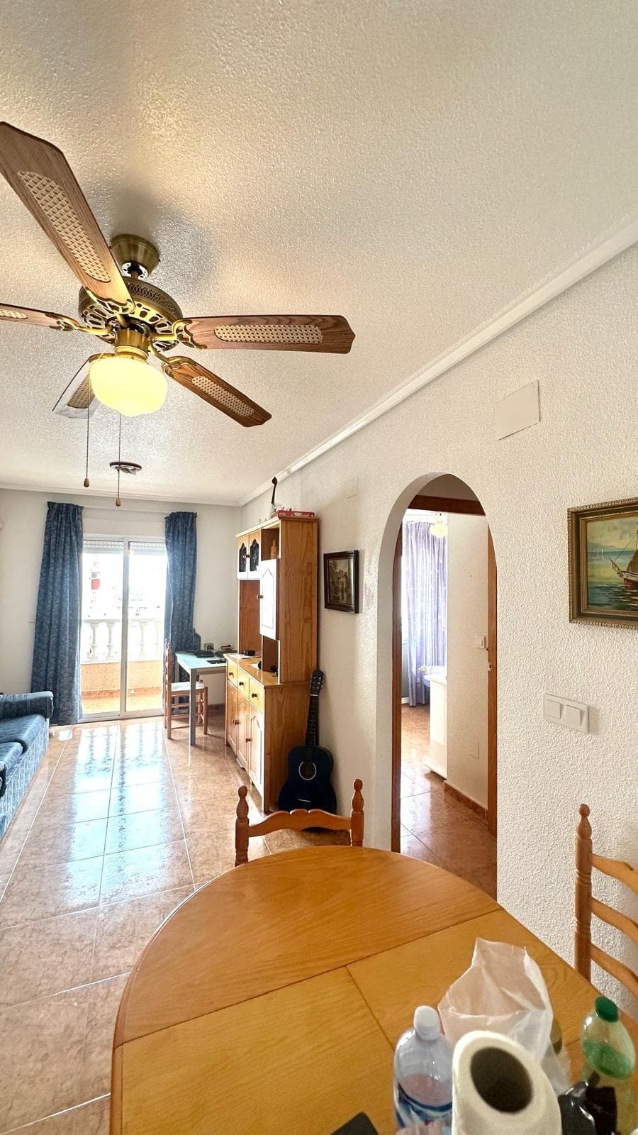 Apartment with Corner Terrace Just 760 Meters from the Beach – Quiet Location with All Amenities We present this wonderful apartment located in one of the quietest and most convenient areas of Torrevieja, ideal both as a permanent home or for a holiday by the sea. Just 760 meters from the beach, you can enjoy the Mediterranean in just minutes, and you'll also have all the amenities nearby: supermarkets, restaurants, public transport, pharmacies, and leisure areas. This apartment is located on the third floor of a well-maintained building with an elevator, providing wonderful natural light and a sense of tranquility due to the lack of direct street noise. Highlights: 2 double bedrooms, both with wardrobes and plenty of natural light. Corner terrace, perfect for breakfast al fresco or enjoying sunny afternoons. Spacious living-dining room with well-integrated spaces to create a cozy and functional atmosphere. A separate kitchen with plenty of storage space is separated from the living area for added convenience. East-facing, ensuring plenty of light in the morning, is combined with south-facing windows for excellent ventilation and clarity throughout the day. Its location and layout make this apartment a perfect opportunity for both those looking for a move-in-ready home and those looking to invest in a home with great potential for vacation or tourist rentals. Would you like to visit it and see every corner? Contact us and we'll show you around!