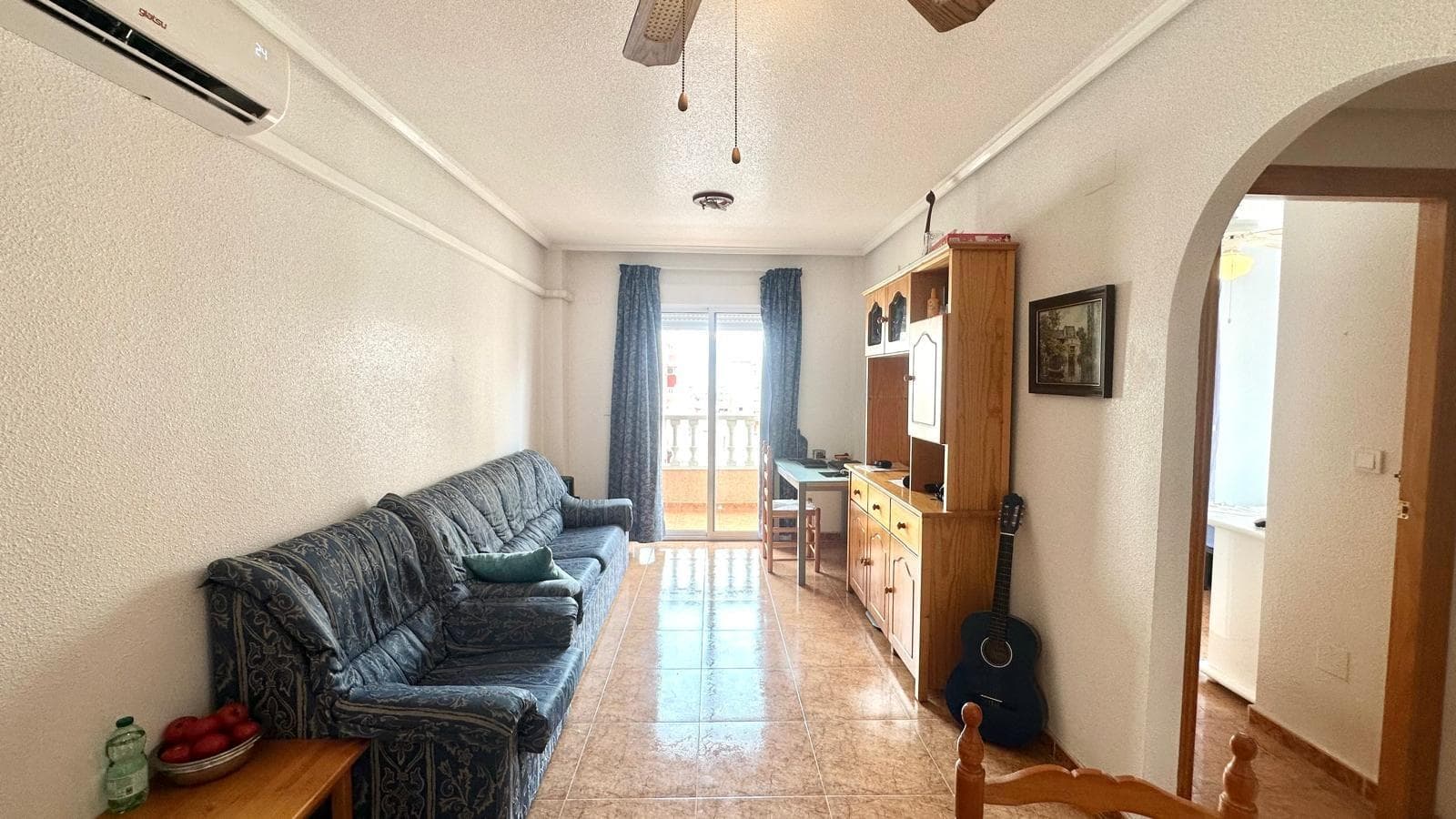 Apartment with Corner Terrace Just 760 Meters from the Beach – Quiet Location with All Amenities We present this wonderful apartment located in one of the quietest and most convenient areas of Torrevieja, ideal both as a permanent home or for a holiday by the sea. Just 760 meters from the beach, you can enjoy the Mediterranean in just minutes, and you'll also have all the amenities nearby: supermarkets, restaurants, public transport, pharmacies, and leisure areas. This apartment is located on the third floor of a well-maintained building with an elevator, providing wonderful natural light and a sense of tranquility due to the lack of direct street noise. Highlights: 2 double bedrooms, both with wardrobes and plenty of natural light. Corner terrace, perfect for breakfast al fresco or enjoying sunny afternoons. Spacious living-dining room with well-integrated spaces to create a cozy and functional atmosphere. A separate kitchen with plenty of storage space is separated from the living area for added convenience. East-facing, ensuring plenty of light in the morning, is combined with south-facing windows for excellent ventilation and clarity throughout the day. Its location and layout make this apartment a perfect opportunity for both those looking for a move-in-ready home and those looking to invest in a home with great potential for vacation or tourist rentals. Would you like to visit it and see every corner? Contact us and we'll show you around!