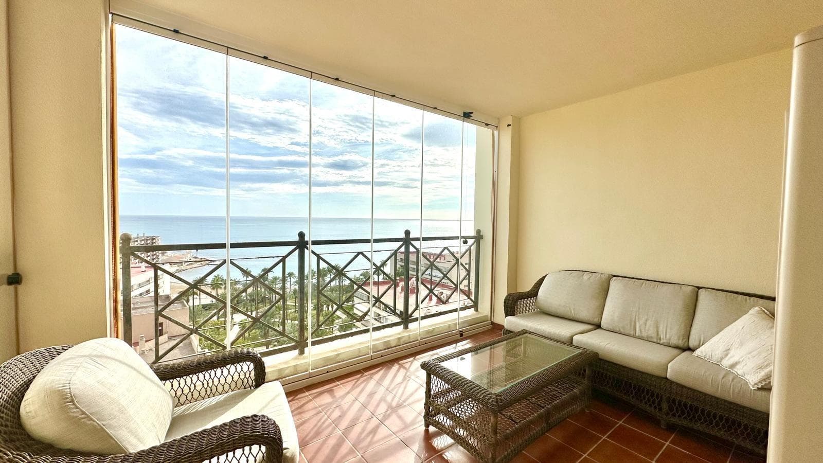 Located in the prestigious Aldea del Mar residential complex, on the 12th floor, this exceptional flat is just 200 metres from the beach, offering the perfect combination of exclusivity, spectacular views and absolute comfort. Its elevated and privileged position allows you to enjoy one of the most impressive panoramic views of Torrevieja, turning every room into a viewpoint overlooking the Mediterranean. The property has three spacious and bright bedrooms, all with the unique feature of offering direct sea views, an exclusive detail that greatly enhances the value of this property. It also has two bathrooms, one of which is en-suite, designed to provide greater comfort and independence to the master bedroom. The modern, fully integrated American-style kitchen opens onto a cosy living-dining room, creating a spacious, practical and bright atmosphere. The open-plan design allows you to enjoy the sea views even from this area, reinforcing the feeling of spaciousness and connection with the surroundings. The property is equipped with central air conditioning, ensuring an ideal temperature throughout the year. It also has a south-facing glazed terrace, a perfect space to enjoy the sun throughout the day and contemplate panoramic sea views that are sure to impress. The Aldea del Mar residential complex is renowned for its tranquillity, exclusivity and architectural beauty. It has spacious communal areas with great attention to detail, including three communal swimming pools, ideal for relaxing and enjoying the Mediterranean climate. Security is another of its strong points, as it has a 24-hour concierge service, offering peace of mind and privacy to all its residents. Located in the heart of Torrevieja and just a few minutes' walk from the beach, Aldea del Mar has established itself as one of the most exclusive areas of the city, combining proximity to all amenities with a distinguished, high-end residential environment. Overall, this flat on the 12th floor of Aldea del Mar represents a unique opportunity for those seeking unrivalled views, exclusivity, spaciousness, comfort and a privileged location facing the sea. An extraordinary property, difficult to match in the area.
