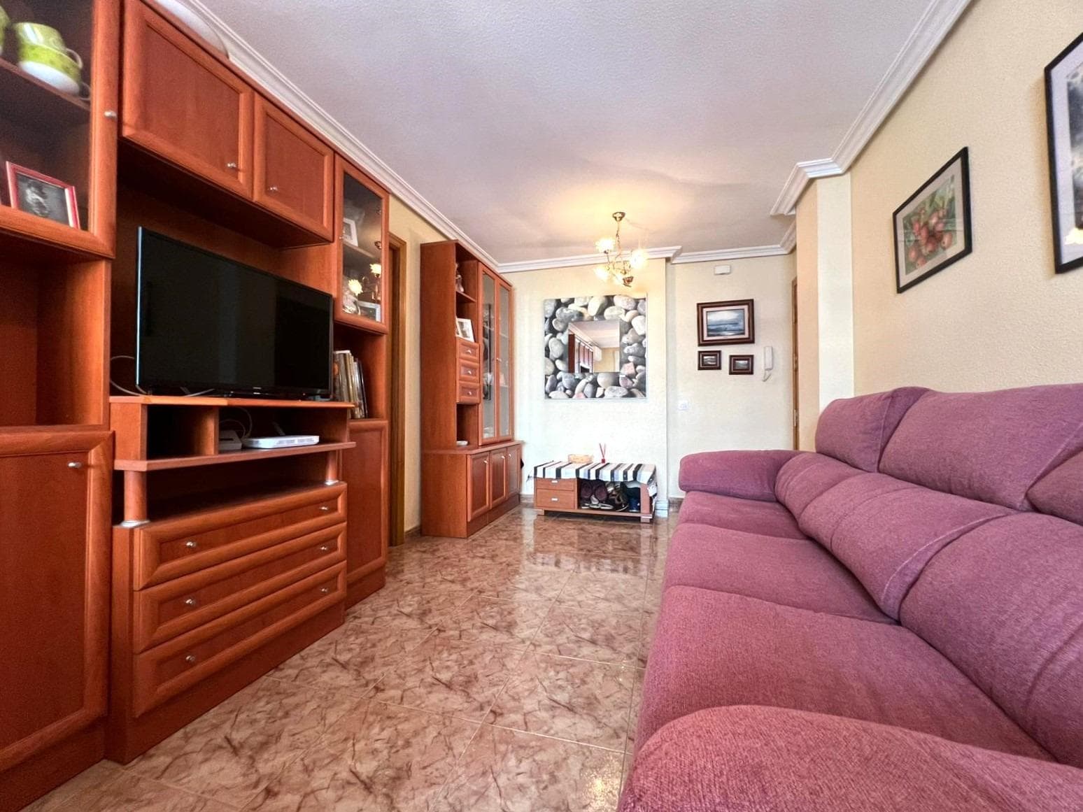 Charming 2 bedroom flat close to all amenities in Torrevieja. Walking through the door of this charming two-bedroom flat, you can feel a cosy and well-kept atmosphere. Located in a quiet and well-maintained building, this property offers the perfect balance of functionality and comfort. The living room is spacious and is connected to a pleasant balcony, ideal for enjoying a moment of rest in the open air, reading a book or sharing a quiet dinner. The kitchen, independent and fully equipped, offers everything you need for day-to-day living, with enough space to organise it according to your needs. The two bedrooms stand out for their spaciousness, offering more than enough space to create comfortable and functional spaces. The bathroom, as well, is in good condition and equipped with everything you need for day-to-day living, with a practical layout that makes it easy to use and store. The flat is located in a consolidated neighbourhood, with all services within easy reach: supermarkets, schools, pharmacies, public transport, cafés and green areas. An ideal option both for year-round living and for enjoying a second home near the sea, in a lively area with all amenities. LOCATION: Torrevieja is in the province of Alicante (Costa Blanca). It is famous for its Mediterranean climate and its coast. We cannot forget its promenades where we can find some restaurants along the fine sandy beaches. It also has many excellent beaches such as Playa de los Náufragos, Playa de los Locos and Playa de la Mata. Therefore, it is considered a remarkable tourist town where the environment takes an important place as an important tourist attraction. In addition, we can find many shopping centres (Habaneras, La Zenia Boulevard), golf courses, sport centres, hospitals (such as Hospital Universitario de Torrevieja) and airports such as Alicante Airport (35 km away) and Region of Murcia International Airport (43 km away). DISTANCE TO THE SEA: 500m COMUNITY: 272 €. IBI: 370 €. Should you have any question do not hesitate to contact us!