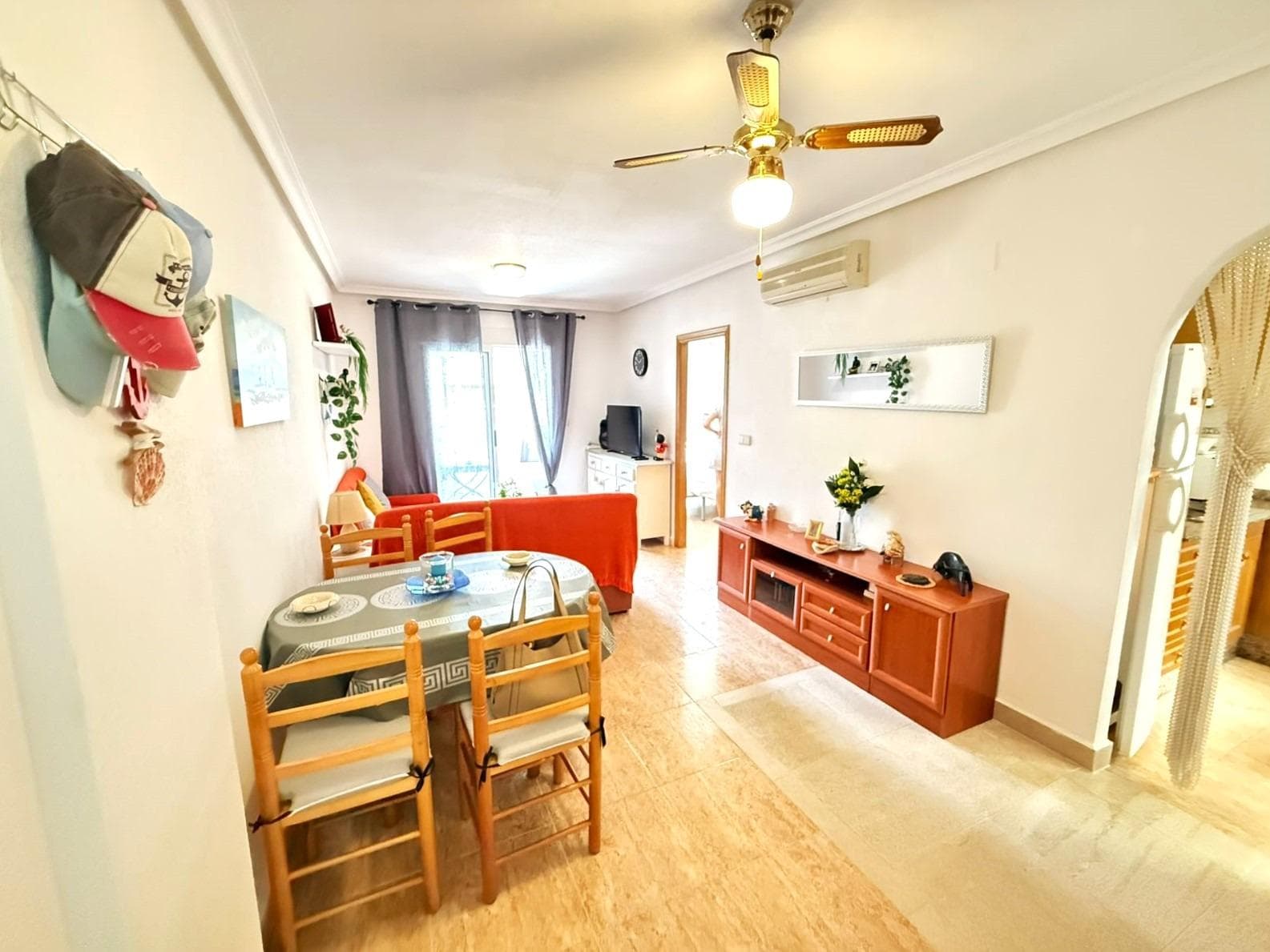 Beautiful 2 bedroom flat 250 metres from the beach in Torrevieja Upon entering this flat, the first thing that strikes you is the natural light that floods every corner. Its orientation turns the living room into a warm and luminous space throughout the day, ideal to enjoy moments of relaxation or to share with friends. The property has two bedrooms. The master bedroom offers a cosy atmosphere, with a built-in wardrobe that provides comfort. The second bedroom, equally luminous, is ideal as a guest room, office or children's room. The fully equipped kitchen is perfectly integrated, offering a practical and pleasant space. 2 bathrooms add comfort to life. But undoubtedly, one of the main attractions of this flat is its surroundings. It is only 250 metres from Los Locos beach. There are plenty of restaurants, cafes and supermarkets nearby. LOCATION: Torrevieja is in the province of Alicante (Costa Blanca). It is famous for its Mediterranean climate and its coast. We cannot forget its promenades where we can find some restaurants along the fine sandy beaches. It also has many excellent beaches such as Playa de los Náufragos, Playa de los Locos and Playa de la Mata. Therefore, it is considered a remarkable tourist town where the environment takes an important place as an important tourist attraction. In addition, we can find many shopping centres (Habaneras, La Zenia Boulevard), golf courses, sport centres, hospitals (such as Hospital Universitario de Torrevieja) and airports such as Alicante Airport (35 km away) and Region of Murcia International Airport (43 km away). DISTANCE TO THE SEA: 250 m COMUNITY: 360 €. IBI: 220 €. Should you have any question do not hesitate to contact us!