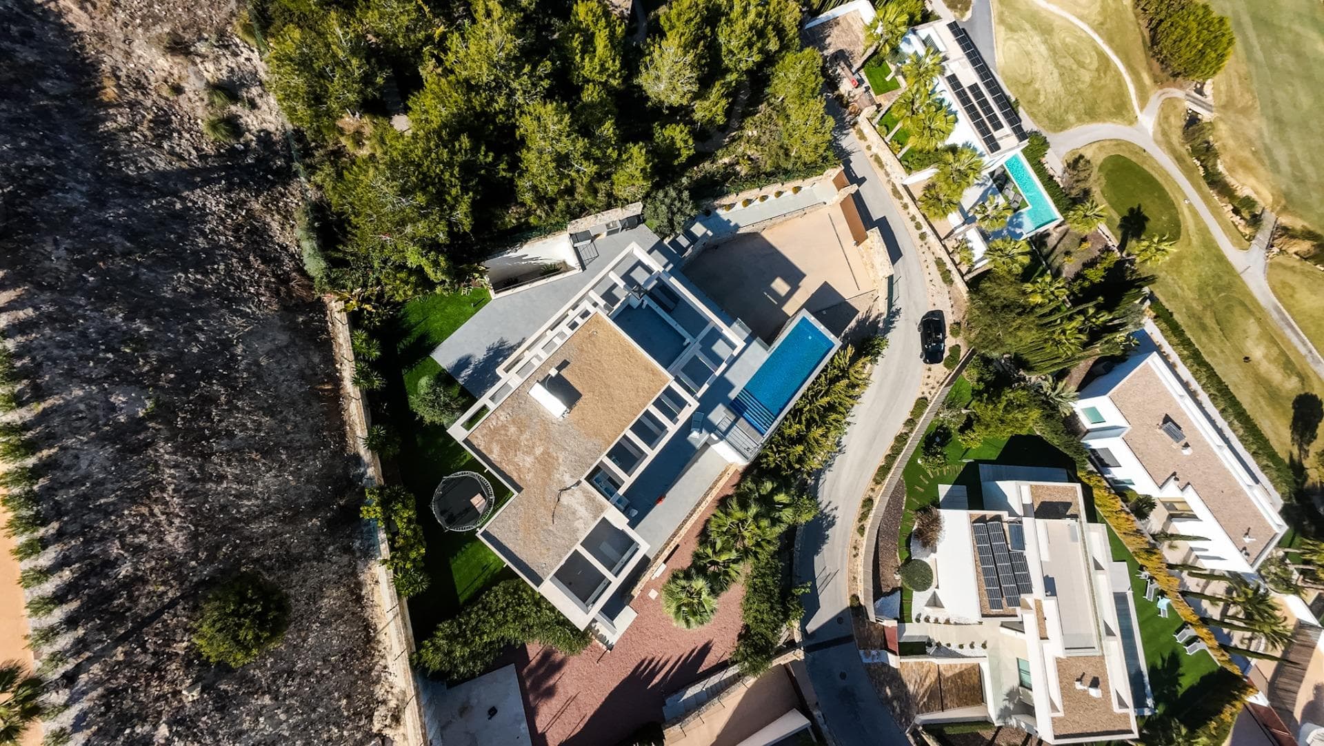 Exceptional 6-bedroom villa located in the prestigious Madroño community of Las Colinas Golf & Country Club. Set on a private plot with stunning views over the golf course, this home combines contemporary architecture, high-quality finishes, and an effortless indoor–outdoor lifestyle. The villa features six spacious bedrooms, four bathrooms, and a guest toilet. The open-plan living area connects to a modern kitchen and large terrace with an impressive infinity pool overlooking the natural landscape. The basement level includes a home cinema, fitness room, and a flexible multi-use space with the option to create an additional bedroom, office, or studio. Located within one of Spain’s top residential resorts, residents benefit from 24-hour security, full privacy, gourmet dining, sports facilities, nature trails, and one of Europe’s best golf courses.