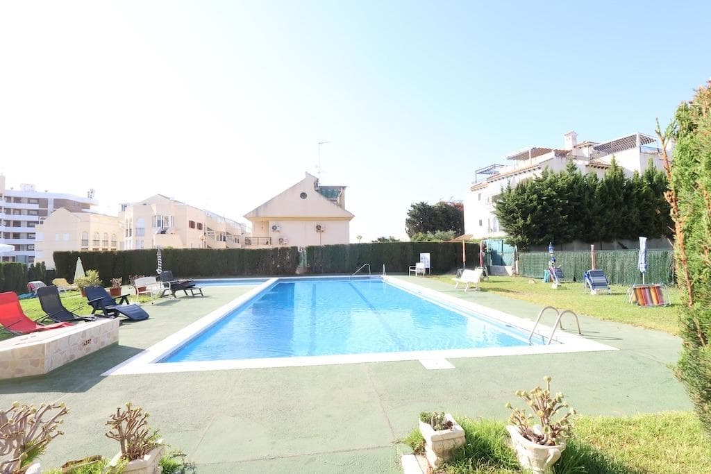UNIQUE OPPORTUNITY FOR INVESTORS!!!. . Ground floor commercial premises of 98 m² for sale, located on the beach side of La Zenia, within walking distance to the beach. It comes with an approved and paid license for change of use to up to 3 residential units.. . Attached is the floor plan for the 3 units: 2 studios and 1 one-bedroom apartment, although it can be modified according to the final client's preferences.. . The property has direct access from the main entrance of the building as well as from the communal pool area, providing both versatility and convenience.. . It also features access to a communal swimming pool and communal parking.. . Its prime location, close to the sea and all amenities, makes it ideal for both residential and tourist use.