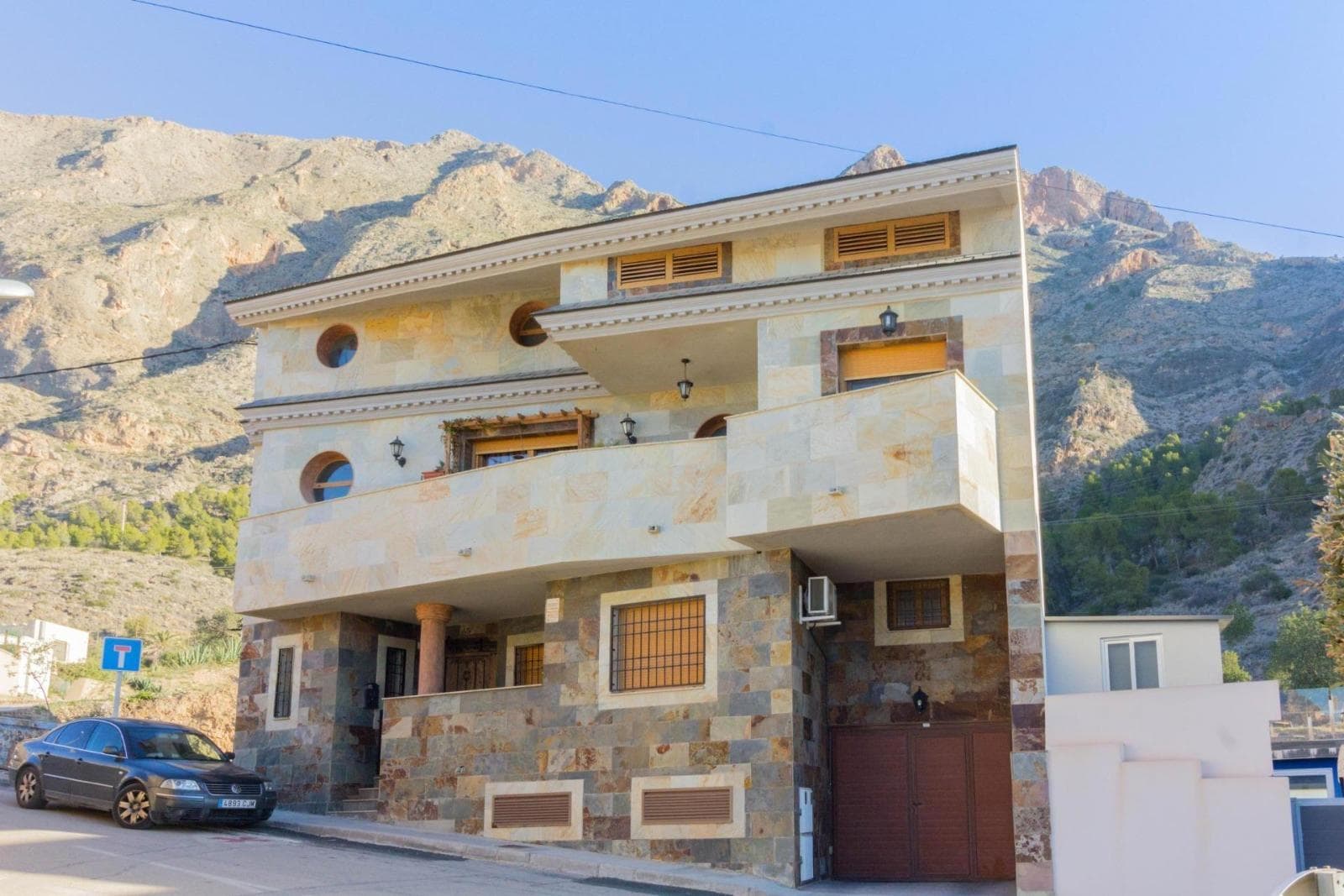There are houses that are not only built with stone, wood, or blueprints... they are built with stories. This home was born from the love of a family, from a dream shared between two people who, in 2001, bought a plot at the foot of the mountains to create their refuge, their home.In 2005, they made it a reality: a solid, beautiful house with character, designed to grow, to gather, to enjoy. From the very first step onto the land, you can feel it’s no ordinary house. Every corner shows care, every room radiates harmony.On the ground floor, a semi-finished apartment awaits new ideas: a space for guests, for working from home, or for a child to start their independence. From here, you access the jewel of the outdoors: a cozy summer kitchen, a pool with mountain views, and a terrace perfect for sunsets that stop time.The main floor was the heart of the home: three bedrooms, a large kitchen where family meals were prepared, and a soulful living room where laughter and life were shared.On the top floor, the future is shaped as you wish: a workspace, independent apartment, creative space... all under sloping ceilings that look out to the horizon with a calm only nature can offer.This house was a home, a refuge, a place of growth. Now it seeks someone to write the next chapter. And if you’re one of those who feel the energy of a place as soon as you enter… this house will speak to you.