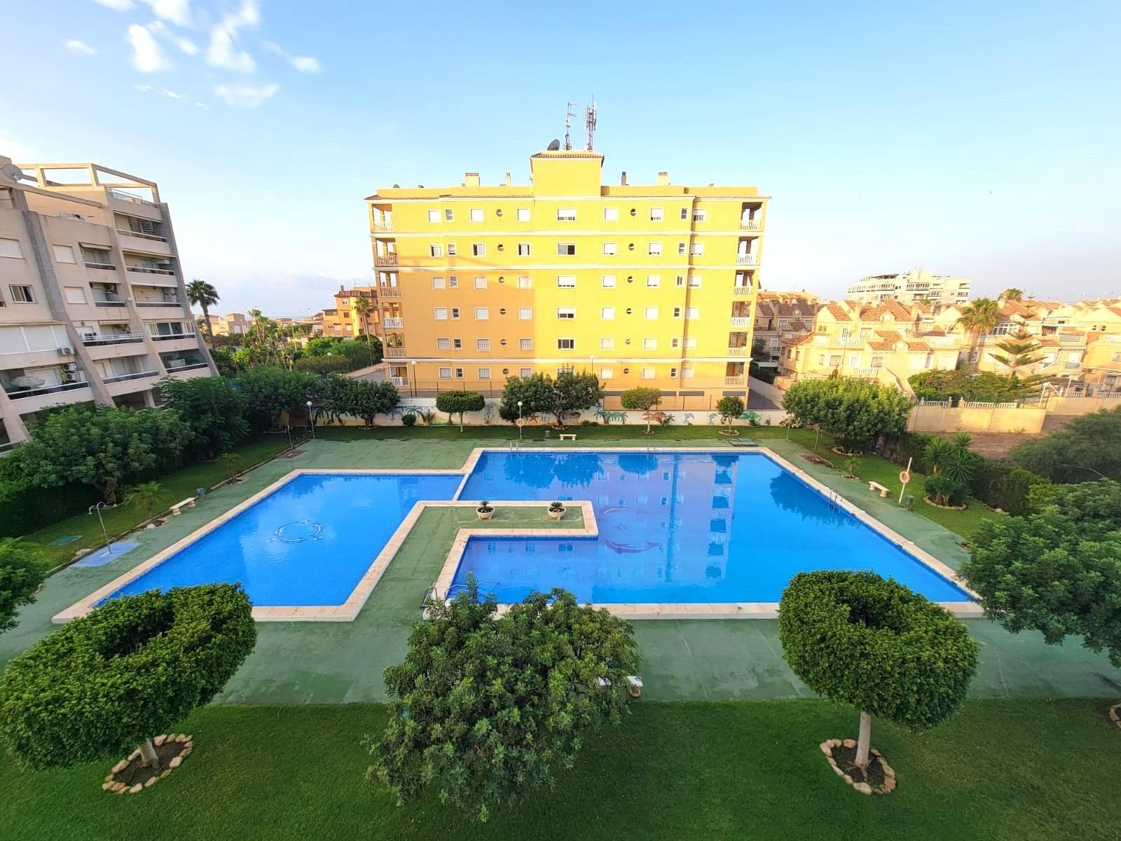 Ground floor apartment located in a lovely Residential Complex about 15 minutes walk to the magnificent beach of La Mata. It consists of a living room with a large glazed terrace converted into a Summer lounge with view to the gardens, a fully equipped American kitchen, a double bedroom with built-in wardrobes and access to the terrace and a bathroom (with shower). Furnished. Air conditioning. Automatic intercom. In very good condition. Easy to park your car in the street near the Residential. All located in a Residential with a large community swimming pool, gardens, trees, Mediterranean plants, sports areas (tennis,..), playground and picnic area. Near all amenities, restaurants, cafes, shopping center, supermarkets, bus stops, and so on. Perfect to live all year round or to spend holidays and enjoy the beautiful Mediterranean climate!