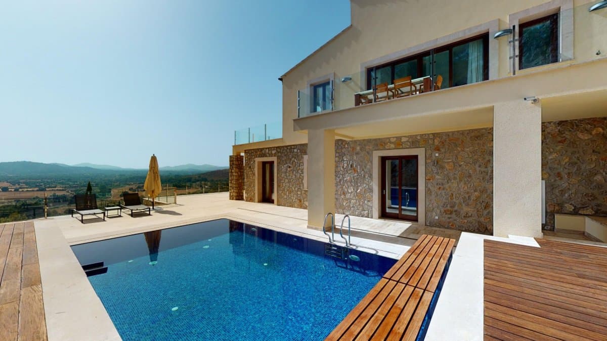 This impressive brand new luxury villa is located in the prestigious Atalaya de Canyamel urbanization, within a luxurious residential complex of single-family homes. Located in a unique environment, the villa is surrounded by magnificent natural landscapes and next to the renowned Canyamel golf course, offering a perfect combination of exclusivity and tranquility.. . The ground floor is distributed in a spacious hall that welcomes you with elegance. A double bedroom with a full en-suite bathroom and fitted wardrobes, providing comfort and privacy. An additional guest toilet. Living room and dining room with large spaces with fireplace and direct access to a terrace, ideal for enjoying moments of relaxation and entertainment. Large kitchen fully furnished and equipped with high-end appliances.. . The first floor has access to the rooms from a large hall. A double master bedroom with fitted wardrobes and en-suite bathroom. Two additional double bedrooms with access to a terrace with pool. A single room with an en-suite bathroom, ideal for guests or service staff. An additional full bathroom. Space for laundry and storage. Technical space accessible from the main terrace through an external staircase.. . The exterior is surrounded by a meticulously maintained garden, with a wide variety of plants and trees that provide beauty and privacy. Terrace with pool accessible from the bedrooms on the first floor. Large open space at the entrance of the house, used as outdoor parking.. . Marble floors provide elegance and durability throughout the villa. Hardwood carpentry, high quality finishes in all rooms. Air conditioning with heat pump to maintain the perfect temperature throughout the year. Underfloor heating that provides great thermal comfort in all seasons. Advanced security surveillance system for peace of mind and protection.. . This villa represents an exceptional opportunity for those seeking a luxury residence in a privileged environment. Its location, design and equipment make it a solid investment and a dream home.. . The price does not include the taxes corresponding to the purchase, nor the notary and property registration expenses.. . For more information or to organize a visit, do not hesitate to contact us. We are available to assist you every step of the process and help you explore this magnificent property.