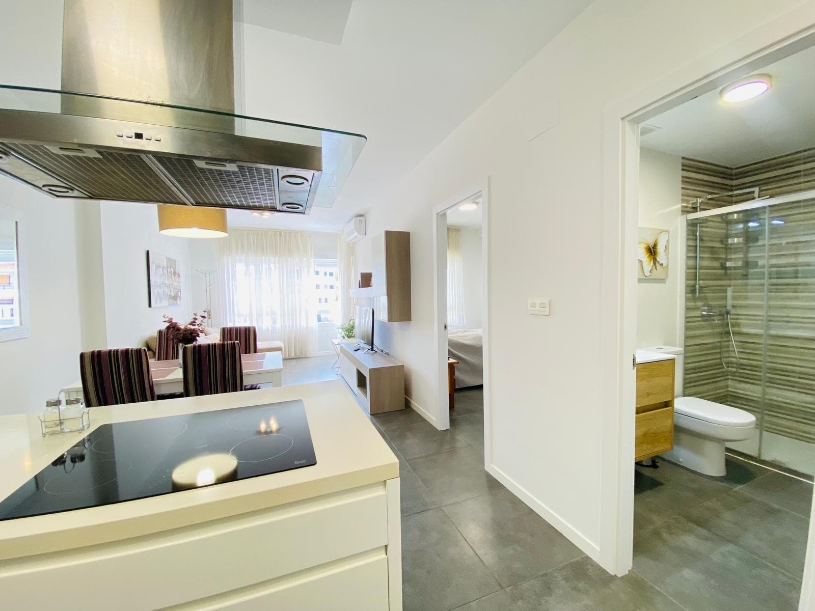 Discover luxury and comfort in this exclusive apartment located in Altos de Campoamor, Orihuela Costa. This modern, nearly new space offers a surface area of 47m2 optimized with a contemporary design that highlights its charm. With a double bedroom illuminated by natural light thanks to its southwest orientation, you will enjoy side sea views from your own corner balcony or private garden within the complex. The equipped kitchen will allow you to prepare exquisite meals while enjoying the coastal ambiance. Relax by the communal pool during the hot summer days or play sports such as tennis and paddle in the facilities available for residents. Strategically located just 800 meters from the Mediterranean Sea and close to the Zenia Boulevard shopping center, you will have easy access to essential services such as health, pharmacies, and gourmet restaurants. Additionally, it includes a private garage space plus storage to maximize your daily comfort; live each day surrounded by Mediterranean splendor.