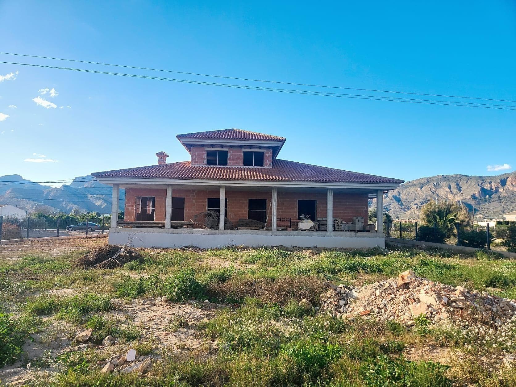 Located on Senda Molina, on the outskirts of Orihuela City, this magnificent estate is for sale with a 5,933 m2 plot of agricultural land and two villas under construction, with all the necessary structures ready for the villas to be completed. This magnificent property is fully fenced and offers you the opportunity to design your own home with an indoor pool, spacious bedrooms with en-suite bathrooms, a Jacuzzi, a game room, a solarium, and several living rooms, all ready for the finishing touches. Surrounded by the serenity of nature, it's just 5 minutes from the center of Orihuela. With quick access to the Murcia-Alicante highway, you'll enjoy an unbeatable location that combines tranquility and connectivity. Located 30 minutes from the best beaches on the Costa Blanca and close to the towns of Almoradí, Callosa del Segura, Santomera, Murcia, and Beniel. Close to all leisure, healthcare, and education services. The land has all the necessary urban services: water, electricity, sewage, and street lighting. Don't miss this unique opportunity in a privileged residential setting. Come and see it and start imagining your future here! Nearby locations: -3 km from OCIOPIA Shopping Center -1 km from Orihuela Train Station -3 km from Carrefour Shopping Center -2 km from Orihuela Health Center -10 km from Orihuela Hospital -30 km from Torrevieja
