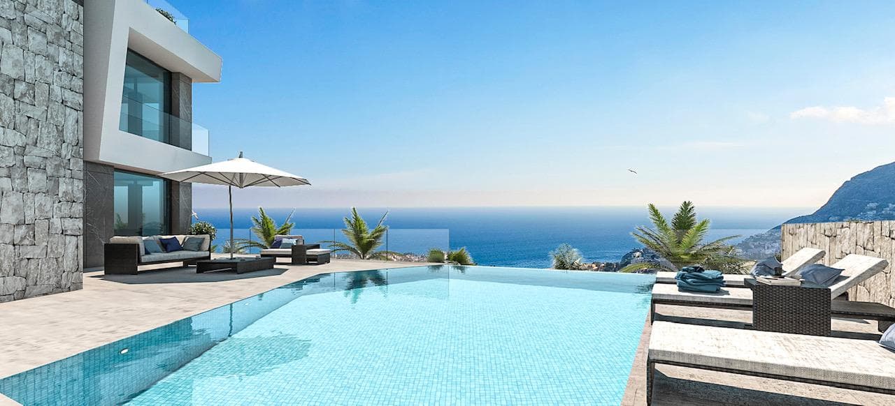 LUXURY VILLA WITH SEA VIEWS&#13;&#13; Modern detached luxury villa with stunning sea views.&#13;&#13; The property has a lift that connects the 3 floors of the house. From all the bedrooms and from the living room you can enjoy spectacular sea views. &#13;&#13; Its infinity pool will allow you to take a relaxing bath while you feel how you merge with the horizon, the Mediterranean Sea and its blue sky.&#13;&#13; The development is located less than 2 km from the beach and the centre of Calpe, with all the necessary services.&#13;&#13; Alicante airport is 70 km away and Benidorm with its wide range of leisure activities is only 20 km away. &#13;&#13; From Calpe you can access a wide range of golf courses, international schools, marinas and nautical sports, varied gastronomy and all this in a climate with 300 days of sunshine a year and an average annual temperature of 20ºC.&#13;