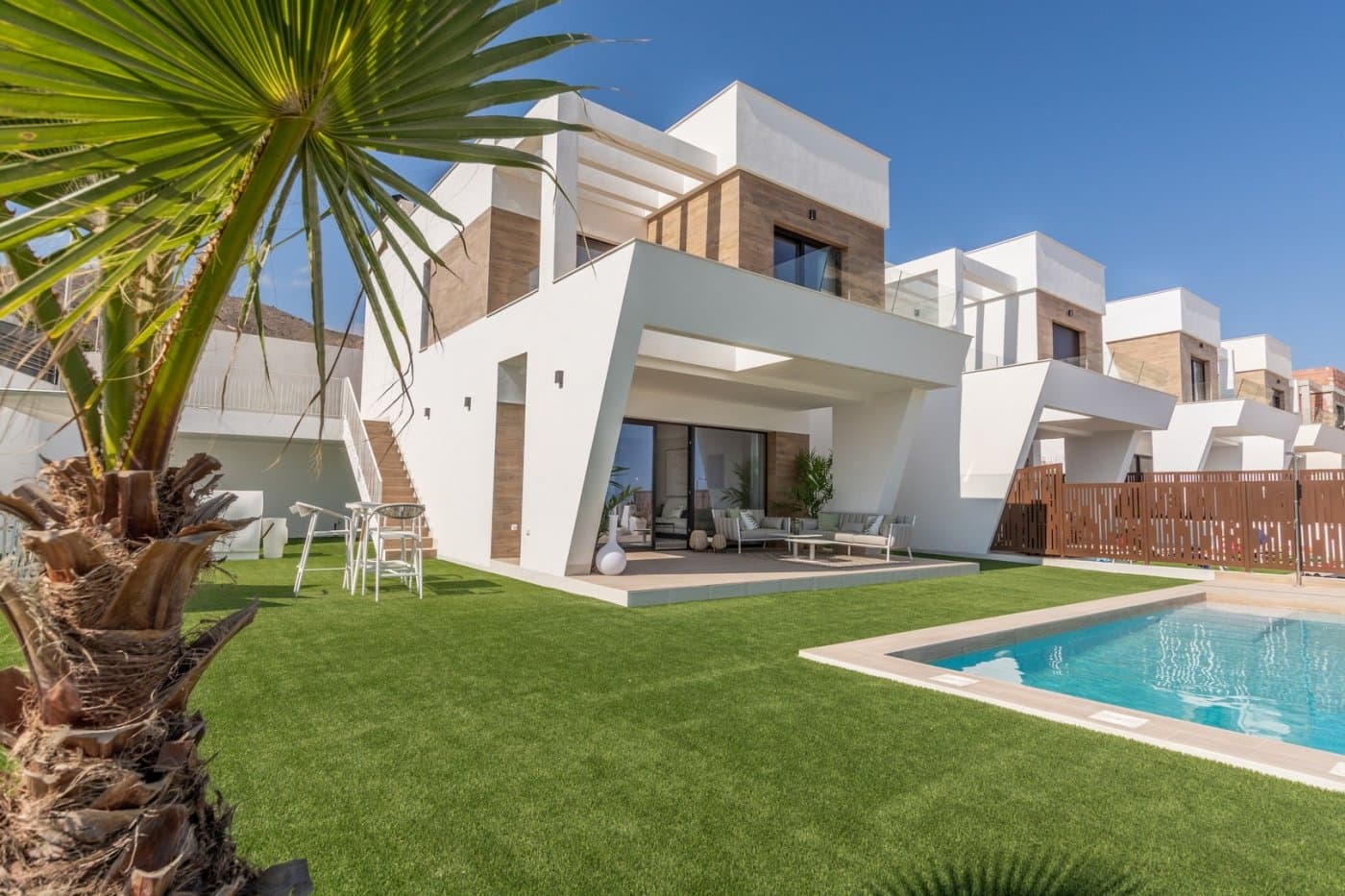 NEW BUILD VILLAS WITH PRIVATE POOL AND GUEST HOUSE  New Build an exclusive residential complex of villas located in Finestrat close to the marvellous beaches of Benidorm. New model of beautiful villa with a guest house on the plot. There are 17 villas of this type for sale.  The villa is built on two floors. On the ground floor, there is a bright living room, with large windows and direct access to the pool and garden, bedroom and bathroom.  On the first floor, there are two suite-style rooms, with access to an open terrace. A guest house is built on one level, consisting of a bedroom and a bathroom, in addition to this, there is a cozy terrace with access to the main villa, pool and garden. Residential located 5 min by car from all the services that Benidorm can offer and in an environment with an average annual temperature of 20ºC and 300 days of sunshine a year, 44 km away from Alicante airport, 3 km from the sea and 200 meters to the golf.