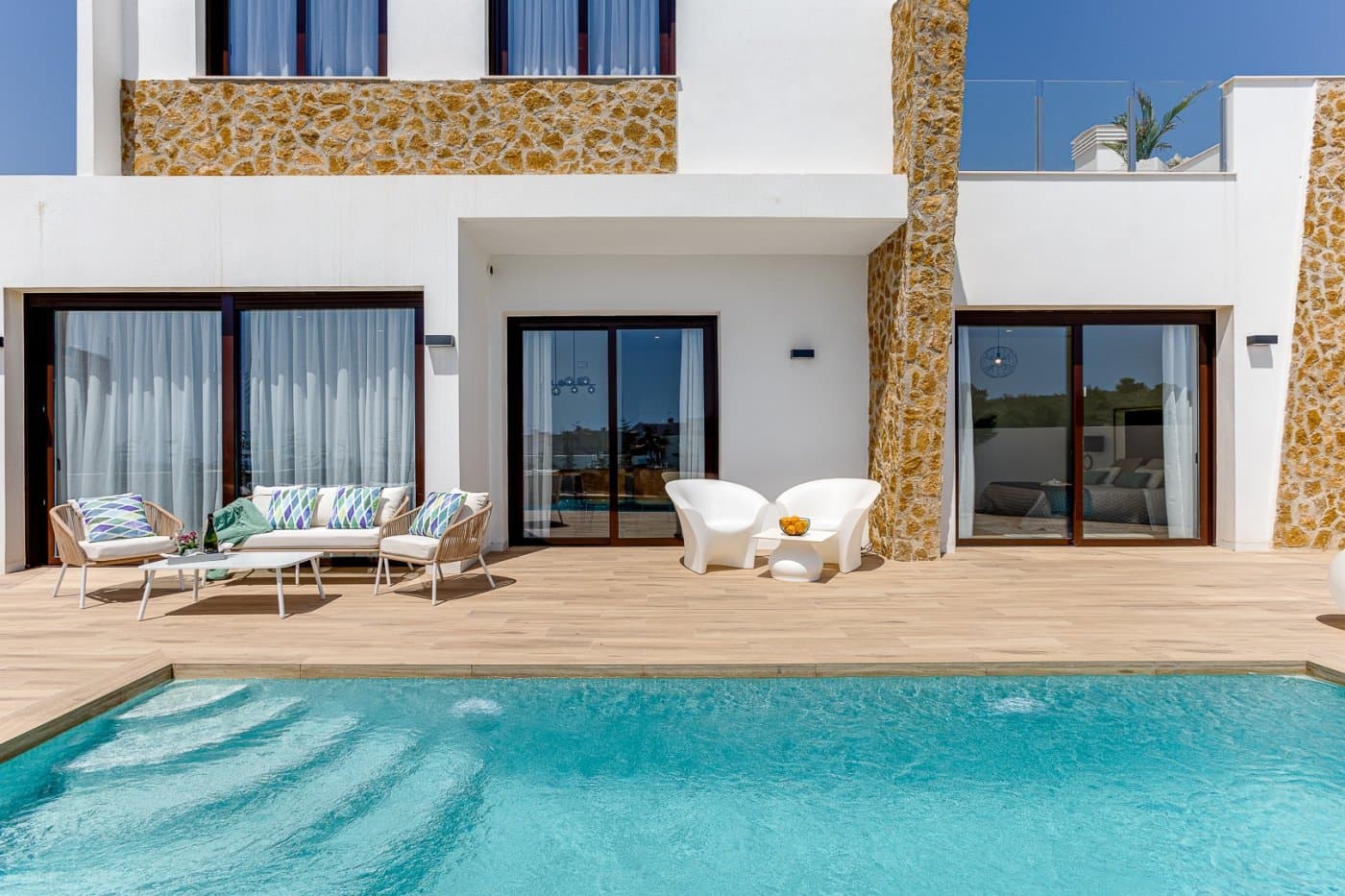 NEW BUILD VILLAS IN BALCON DE FINESTRAT&#13;&#13; New Build modern villas in Balcon de Finestrat.&#13;&#13;Wide and bright villas with 3 bedrooms and 2 bathrooms, open plan kitchen with living-dining area, beautiful terrace, private garden with the pool and parking space.&#13;&#13;Combination of wood and natural stone makes the house modern and rustic at the same time.&#13;&#13;Villas located 10 minutes from Benidorm and only 2 km from Finestrat. The ride to Tierra Mitica where you can spend nice time with family will take 6 minutes. This location makes it a great choice for a holiday home.&#13;&#13;Finestrat located in the Marina Baixa region of the Costa Blanca, close to neighbouring Benidorm and about 40 kilometres from the city of Alicante and the international airport. &#13;&#13;The village is situated on the mountainside of Puig Campana and offers beautiful views of the mountains, the coast and the Mediterranean Sea.&#13;&#13;Benidorm is just a five-minute drive from the properties and offers all the services you would need including shops, bars, restaurants, supermarkets, banks, pharmacies and several private international schools.&#13;&#13;Close to the beaches of Levante, Poniente and Cala de Finestrat, with more than 6km in length that are among the best in Europe awarded by the European Union with Blue Flags.&#13;&#13;All leisure services such as the theme parks of Aqua Natura, Terra Mítica, Terra Natura, Aqualandia and Mundomar, Sierra Cortina and Villaitana Golf courses, hiking and climbing in Puig Campana an incomparable natural setting or enjoy of nautical sports.&#13;&#13;