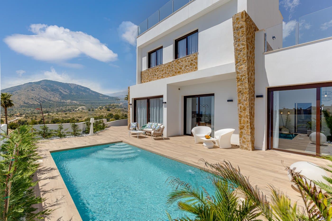 NEW BUILD VILLAS IN BALCON DE FINESTRAT&#13;&#13; New Build modern villas in Balcon de Finestrat.&#13;&#13;Wide and bright villas with 4 bedrooms and 4 bathrooms, open plan kitchen with living-dining area, beautiful terrace, private garden with the pool and parking space.&#13;&#13;Combination of wood and natural stone makes the house modern and rustic at the same time.&#13;&#13;Villas located 10 minutes from Benidorm and only 2 km from Finestrat. The ride to Tierra Mitica where you can spend nice time with family will take 6 minutes. This location makes it a great choice for a holiday home.&#13;&#13;Finestrat located in the Marina Baixa region of the Costa Blanca, close to neighbouring Benidorm and about 40 kilometres from the city of Alicante and the international airport. &#13;&#13;The village is situated on the mountainside of Puig Campana and offers beautiful views of the mountains, the coast and the Mediterranean Sea.&#13;&#13;Benidorm is just a five-minute drive from the properties and offers all the services you would need including shops, bars, restaurants, supermarkets, banks, pharmacies and several private international schools.&#13;&#13;Close to the beaches of Levante, Poniente and Cala de Finestrat, with more than 6km in length that are among the best in Europe awarded by the European Union with Blue Flags.&#13;&#13;All leisure services such as the theme parks of Aqua Natura, Terra Mítica, Terra Natura, Aqualandia and Mundomar, Sierra Cortina and Villaitana Golf courses, hiking and climbing in Puig Campana an incomparable natural setting or enjoy of nautical sports.&#13;&#13;