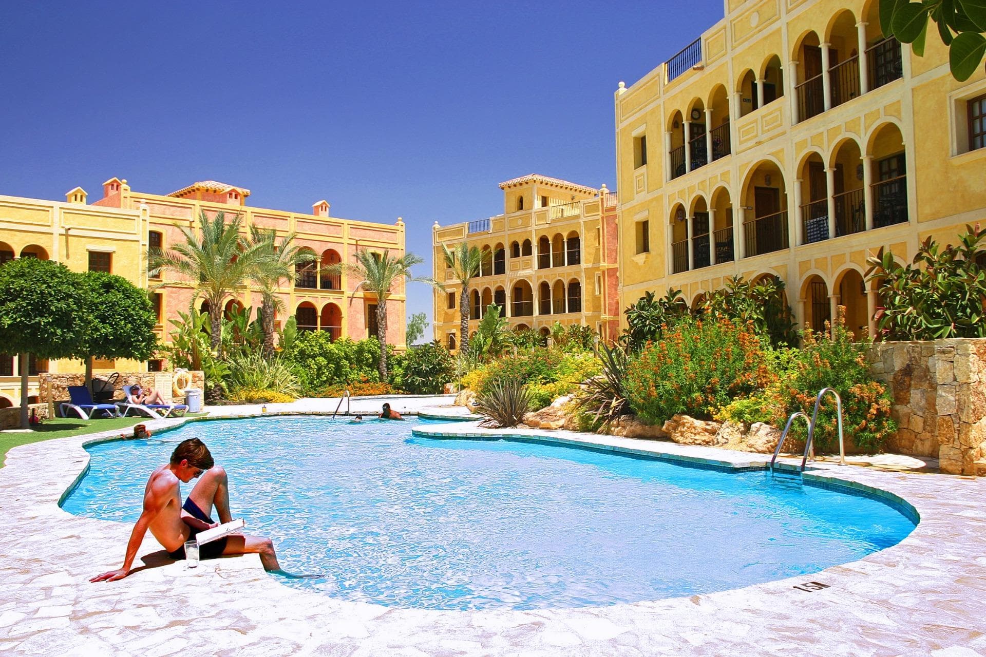 STUNNING NEW APARTMENTS IN DESERT SPRINGS RESORT

A unique opportunity to purchase from a LIMITED selection of newly released, key-ready two-bedroom apartments.

These stunning two-bedroom apartments are located within a Spanish-style courtyard with communal swimming pool and benefit from views over the beautifully landscaped communal gardens.

The exteriors have maintained the heritage of tradition, with wooden and iron verandas and balconies and a wealth of attractive external detail, while the interiors offer a stylish contemporary home with modern appeal.

High quality finishings include an attractively tiled bathroom and shower room. An open-plan kitchen with a scratch and stain resistant ‘Compac’ countertop, with the fridge/freezer and washing machine integrated within the cupboards. Ceramic hob, cooker hood and microwave. Air-conditioning, double glazing, mirrored wardrobes to bedrooms with high quality sanitary ware and fittings throughout.

Each property has the use of a parking area and a private roof solarium. 

Easy access to all resort facilities
