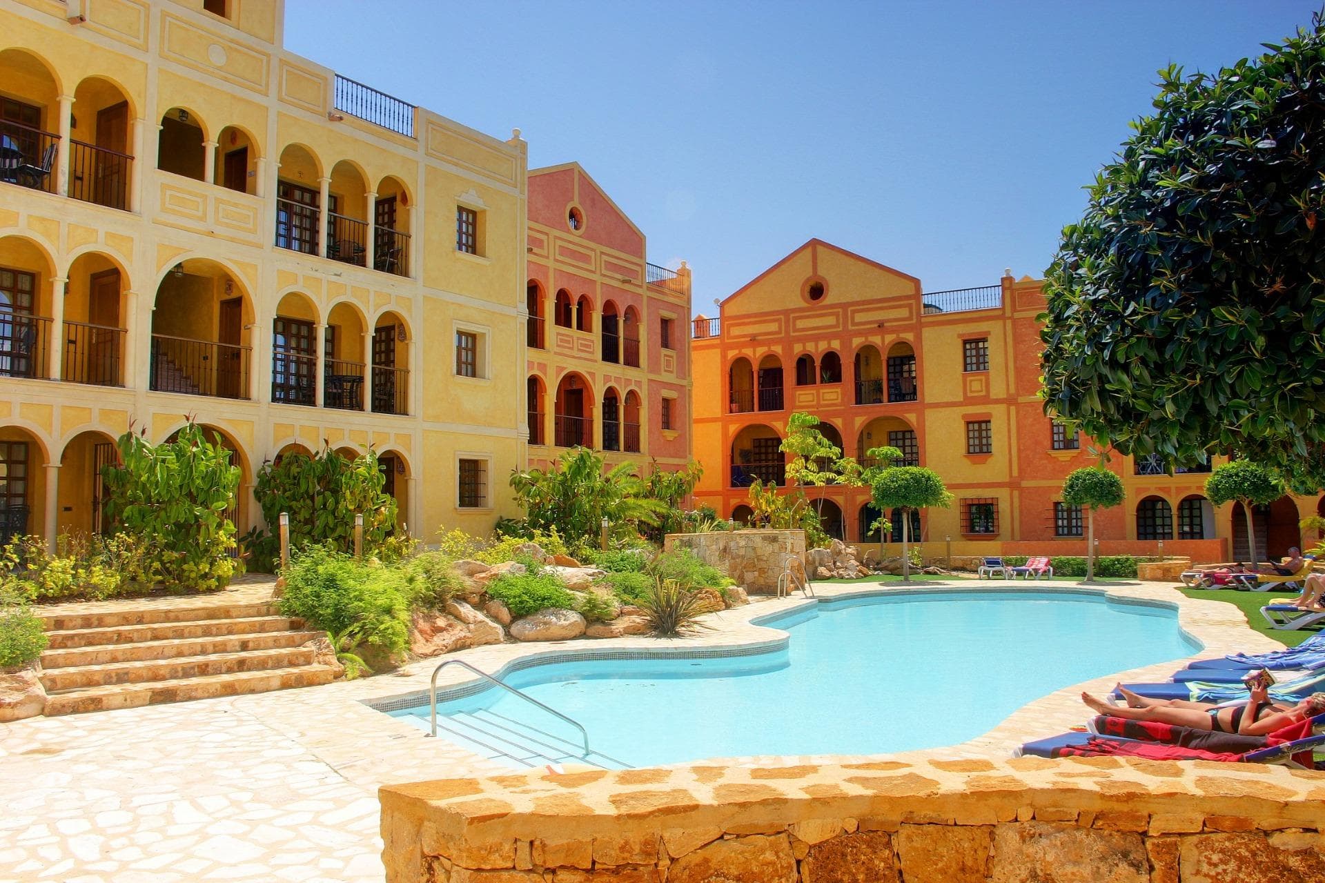 STUNNING NEW APARTMENTS IN DESERT SPRINGS RESORT

Stunning three-bedroom first floor apartments located within a Spanish-style courtyard with communal swimming pool which benefit from views over the beautifully landscaped communal gardens.

The exteriors have maintained the heritage of tradition, with wooden and iron verandas and balconies and a wealth of attractive external detail, while the interiors offer a stylish contemporary home with modern appeal.

High quality finishings include an attractively tiled bathroom and shower room. Open-plan kitchen with a scratch and stain resistant ‘Compac’ countertop, with the fridge/freezer and washing machine integrated within the cupboards. Ceramic hob, cooker hood and microwave. Air-conditioning, double glazing, mirrored wardrobes to bedrooms with high quality sanitary ware and fittings throughout.

Each property has the use of a parking area and a private roof solarium. 

Easy access to all resort facilities