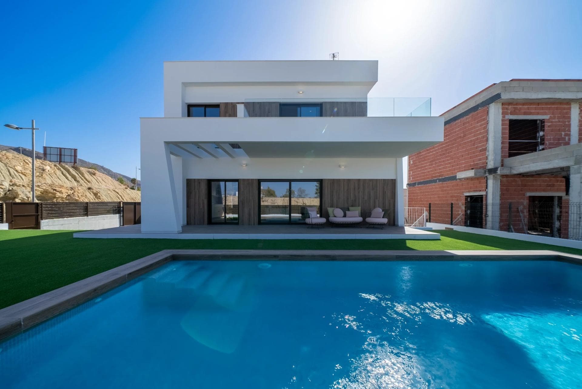 NEW BUILD VILLAS IN FINESTRAT&#13;&#13;Residential of modern villas has been meticulously designed to capture the beauty of Sierra Cortina and the Mediterranean in every corner. &#13;&#13;Villas build over 2 floors and has 3 bedrooms, 3 bathrooms, open plan kitchen with lounge, build-in wardrobes, equipped kitchen, private garden with the pool and parking.&#13;&#13;Residential located ​next to two golf courses, theme parks, a large shopping centre and a few minutes from the beaches of Benidorm&#13;&#13;Finestrat located in the Marina Baixa region of the Costa Blanca, close to neighbouring Benidorm and about 40 kilometres from the city of Alicante and the international airport.&#13;&#13;Benidorm is just a five-minute drive from the properties and offers all the services you would need including shops, bars, restaurants, supermarkets, banks, pharmacies and several private international schools.&#13;&#13;Close to the beaches of Levante, Poniente and Cala de Finestrat, with more than 6km in length that are among the best in Europe awarded by the European Union with Blue Flags.&#13;&#13;All leisure services such as the theme parks of Aqua Natura, Terra Mítica, Terra Natura, Aqualandia and Mundomar, Sierra Cortina and Villaitana Golf courses, hiking and climbing in Puig Campana an incomparable natural setting or enjoy of nautical sports.&#13;