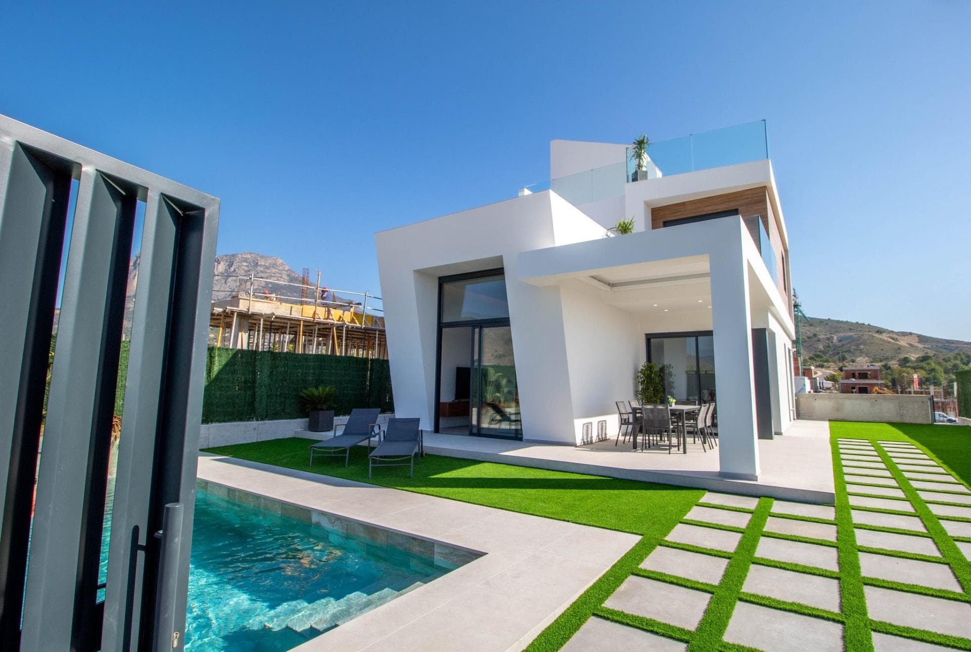 NEW BUILD VILLAS IN FINESTRAT &#13;&#13;New Build residential of 22 villas located in Finestrat.&#13;&#13;Wake up each morning contemplating the views of the sea and the green hills of the golf course beside it. Enjoy the natural light provided by its large windows and its excellent orientation (south facing long façade).&#13;&#13;Modern villas has 3 bedrooms, 3 bathrooms, open-plan kitchen with spacious living room, fitted wardrobes, terrace, solarium, private garden with the swimming pool and parking space.&#13;&#13;Your customised home&#13;Villas based on the idea of providing you with a home tailored to your needs, which is why each house can be customised 100%. Our team of architects and interior designers will create each space to your liking to make your dreams come true.&#13;&#13;Modify the interior layout of the house (within the permitted building options). &#13;Add equipment to your walk-in wardrobes and increase the storage capacity and order.&#13;Round off your garden equipment to suit your needs the best (swimming pool and exterior finishes).&#13;Choose among different types of atmospheres and finishes according to your tastes.&#13;&#13;Finestrat is a dream destination!&#13;This land is surrounded by the sea, right under the majestic silhouette of the Puig Campana Mountain, next to the charming historical district. It is the perfect destination for those who are looking for a relaxed place to live without having to give up the comforts of having all the services at hand.&#13;&#13;Finestrat has numerous transportation alternatives to move around freely.&#13;Bus:&#13;The lines 14, 15 and 16 are available to travel between Finestrat, Benidorm and Villajoyosa.&#13;Tram:&#13;On the line that connects Alicante to Benidorm you will find the La Marina – Finestrat shopping centre stop and it will take you to the centre of Alicante in just 1 hour.&#13;El Altet Airport (40 min):&#13;This airport is 40 minutes away from Finestrat and there are flights to the United Kingdom, Belgium, Holland, Milan, Zurich among many other destinations and countless airlines to fly with.&#13;&#13;In Finestrat you will be surrounded by theme parks, where you can enjoy the best leisure activities at your fingertips. Where children and adults alike will learn about the environment, nature and history through adventure.&#13;Terra Mitica (10 min):&#13;Terra Natura (10 min)&#13;Acuanatura (10 min):&#13;&#13;The warm climate of the Levante allows you to enjoy nature and outdoor sports most of the year. The natural landscapes and sports facilities available in Finestrat open up a wide range of possibilities to enjoy the surroundings.&#13;Puig Campana Golf (1min):&#13;One of the newest and best equipped sports facilities in the area. Its 9 holes will allow you to exercise and enjoy the best sporting environment in its many tournaments.&#13;Puig Campana Natural Park (10 min):&#13;Hiking from Font del Molí along the vertical kilometre to the geodesic vertex of Puig Campana is an unforgettable experience.&#13;
