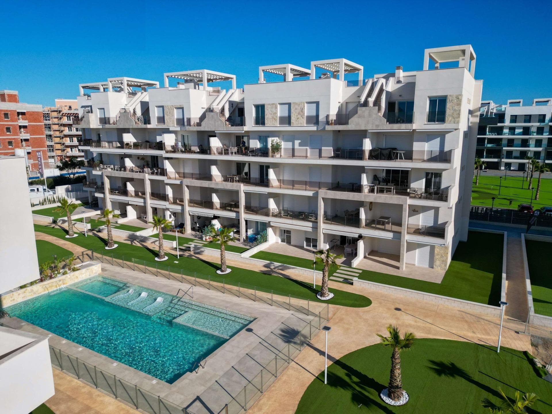 NEW BUILD RESIDENTIAL IN EL RASO, GUARDAMAR DEL SEGURA&#13;&#13;New Build private residential complex of apartments in El Raso, Guardamar del Segura. &#13;&#13;Complex consisting of 135 homes with 2 or 3 bedrooms in blocks of 3 or 5 floors plus solarium, designed in a minimalist way and with high quality standards, its modern architecture harmonises with our large open spaces, nature and swimming pools, offering a unique and peaceful atmosphere. &#13;&#13;Beautiful residential complexes, including a glassed-in GYM-Spa area with views of green areas, swimming pools and from its terrace overlooking the salt lagoon of La Mata, paddle tennis court, etc. &#13;&#13;Parking space included in the price.&#13;&#13;Development is located on a unique and unrepeatable plot, bordering the natural landscape of the salt lagoon, enjoy its biodiversity and unique environment, in El Raso de Guardamar del Segura, with all kinds of services and amenities and close to the best beaches of the Mediterranean. &#13;&#13;At the same time, thanks to the proximity of El Moncayo beach, you will be able to go for a bike ride and enjoy the best climate of the Costa Blanca. &#13;&#13;Additionally and thanks to the five levels of some of the blocks that make up the residential, all of them facing south, we include in our luxury penthouses, fully equipped kitchen on the solarium, outdoor shower (hot/cold water), and jacuzzi area, to complete the unique experience of living in front of a unique and unrepeatable natural environment. &#13;&#13;El Raso is a part of Guardamar del Segura.&#13;&#13;Guardamar del Segura is a town located on the Costa Blanca South. With its 11 kilometres of natural beach and its large pine forest.&#13;&#13;Guardamar del Segura has a large port with activities throughout the year, it has a large sports centre with paddle tennis, tennis, soccer and a large heated swimming pool that works all year round. It also has a library where there is free wifi and computers.&#13;&#13;Guardamar del Segura is only 20km away from the Alicante - Elche (El Altet) airport, where there are many flights every day with connections to the main European cities, due to the demand for tourists on the Costa Blanca.&#13;
