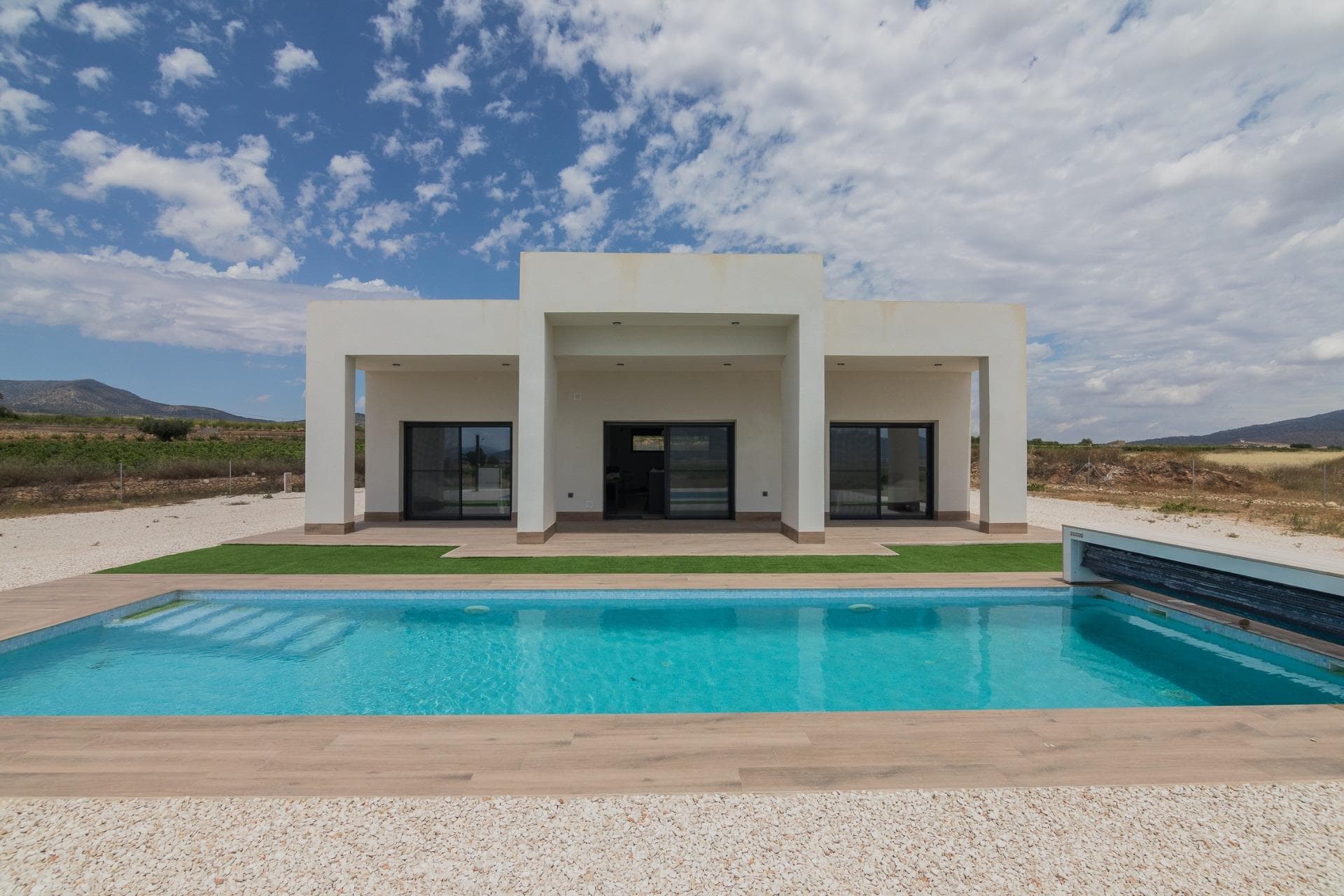 NEW BUILD VILLAS IN PINOSO&#13;&#13;New Build Independent modern villas that can be built on rustic or urban plots of land we have a wide range available in the area of Pinoso:&#13;&#13;•3 bedrooms, 2 bathrooms&#13;• Private swimming pool&#13;• Full installation of air conditioning &#13;• Full equipped kitchen&#13;• Big choice of quality materials&#13;• Mains electricity and water&#13;• 4 solar panels included&#13;• AA Energy Label&#13;• Plots from 10.000 m2 in various locations to choose from. &#13;• 3.000 m² fenced plot for easy maintenance&#13;• Motorised sliding gate&#13;&#13;On the rustic plots, about 3.000 m2 of the total plot will be fenced and the houses will be delivered with about 1.000 m2 of gravel around the house.&#13;The house has a private swimming pool and photovoltaic solar panels for the electricity supply.&#13;There are several rustic plots to choose from in different locations, each with a different price (in the prices published in this advert a plot with a value of 40.000 eur has been considered, if the buyer chooses another plot, the final price will be recalculated accordingly).&#13;The delivery period is 8 months from the granting of the building licence.&#13;It is acquired under a self-promotion regime: the buyer makes payments on account of the price as the builder executes the work.&#13;