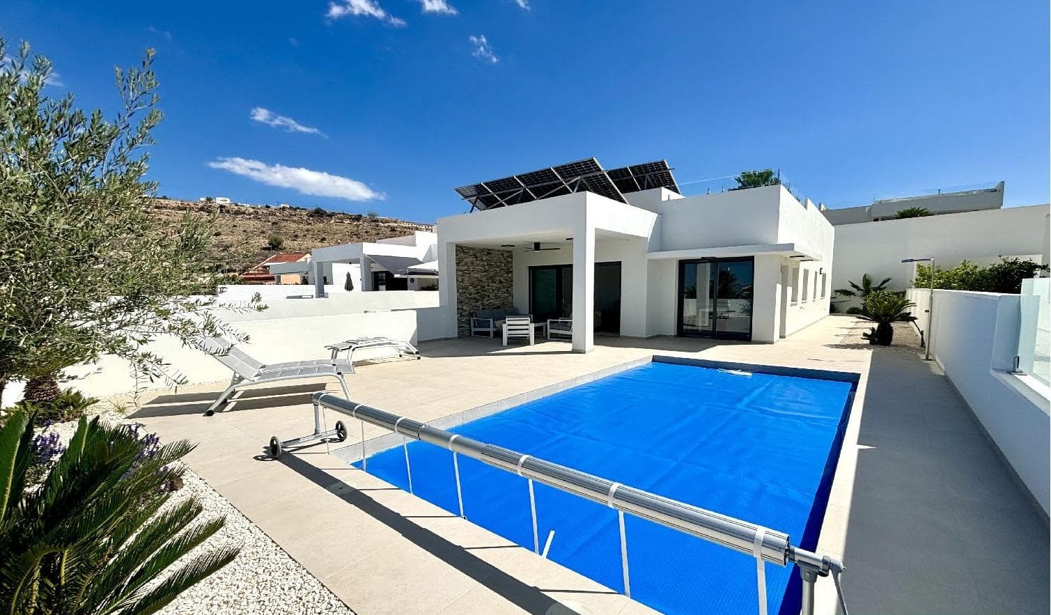 New Build Mediterranean Villas in Benijófar&#13;&#13;Modern and Stylish Villas in Benijófar&#13;Located on the outskirts of the charming town of Benijófar, these stunning, contemporary villas offer the perfect blend of modern design and traditional Spanish living. Benijófar, situated in the heart of Costa Blanca, is just 30 minutes by car from Alicante city and its international airport. The area is also conveniently located 8 km from golden sandy beaches and 10 minutes from two top-quality golf courses.&#13;&#13;Spacious Villas with Private Pools&#13;Each villa sits on a generous plot of over 400 m², featuring a private pool (7x3.5 m) and 3 bedrooms with 2 bathrooms, all on a single floor. Optional extras include a solarium and storage room. The villas are built to the highest standards, with top-quality finishes such as Schüco windows, motorized shutters, photovoltaic solar panels, and an automatic irrigation system for the garden.&#13;&#13;Traditional Spanish Town with Modern Amenities&#13;Benijófar is a traditional Spanish town known for its vibrant fiestas, weekly street markets, and picturesque town square. It borders Ciudad Quesada, just 2 minutes away by car, offering a wide range of amenities including restaurants, bars, shops, live entertainment, a summer water park, and a country club.&#13;&#13;This ideal location offers a perfect year-round residence to enjoy the sun, sea, and your own private pool in a peaceful, traditional setting.&#13;
