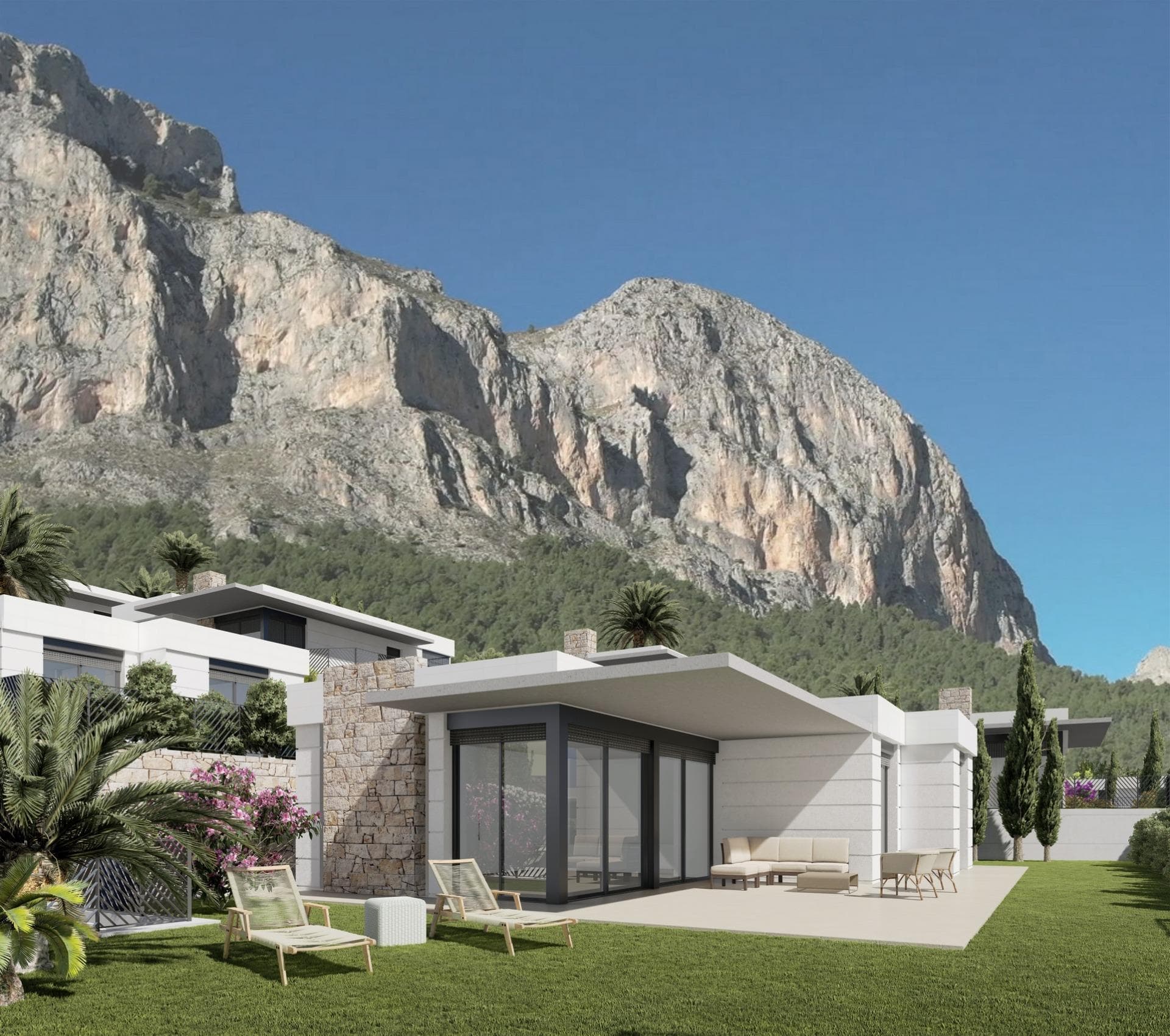 New Construction Villas in Polop, Alicante&#13;&#13;Modern Living Surrounded by Nature&#13;Discover this exclusive residential development of newly built villas in Polop, a charming inland village located in the province of Alicante. Just 10 km from Benidorm’s lively beaches and nightlife and close to the picturesque town of Altea, these homes offer an unbeatable combination of modern comfort and natural beauty.&#13;&#13;A Residential Development Tailored to Your Needs&#13;The project consists of 65 independent villas available in different layouts to suit your needs and budget. Choose between 3 or 4-bedroom homes, with options for single or two-story designs. Many of the properties are designed on a single level, providing enhanced accessibility and a comfortable living experience without the need for stairs.&#13;&#13;Each home is thoughtfully designed with spacious terraces, private gardens, and interior/exterior spaces where you can enjoy the Mediterranean climate. Optional private pools are also available to add an extra touch of luxury to your new home.&#13;&#13;Prime Location with Easy Access to Key Destinations&#13;Located in a peaceful natural setting, the development is ideal for those seeking tranquility without sacrificing convenience. The surrounding area offers access to key points of interest:&#13;&#13;Benidorm Beaches: 10 km (15-minute drive)&#13;Playa del Albir: 12 km (20 minutes), renowned for its pristine waters and scenic promenade&#13;Alicante Airport: 60 km (45 minutes)&#13;Villaitana Golf Course: 12 km (15 minutes)&#13;La Marina Shopping Center: 10 km (15 minutes)&#13;&#13;Premium Features for Modern Comfort&#13;Each villa is equipped with high-quality finishes and state-of-the-art systems, ensuring maximum comfort, security, and sustainability:&#13;Double-glazed PVC windows with thermal and solar insulation&#13;Reinforced front doors for enhanced security&#13;Fully equipped kitchens with induction hob, oven, extractor hood, and stainless-steel sink&#13;Modern bathrooms with stylish porcelain sinks and fittings&#13;Pre-installed ducted air conditioning with heat pump&#13;Hot water supplied via aerothermal systems for energy efficiency&#13;Gated community with perimeter surveillance cameras&#13;&#13;Polop: The Perfect Blend of History and Nature&#13;Polop de la Marina is a historic town surrounded by stunning landscapes. Its charming old town, the Gabriel Miró House-Museum, and various hiking trails make it a sought-after destination for nature and history enthusiasts.&#13;&#13;Experience Coastal and Countryside Living&#13;Embrace a new lifestyle in these carefully designed homes, where comfort meets nature. Enjoy the panoramic views through large windows that frame the surrounding landscape, creating the perfect balance between indoor and outdoor living.&#13;&#13;Don’t miss the opportunity to own your dream home in Polop! Contact us today for more information and to schedule a visit.&#13;