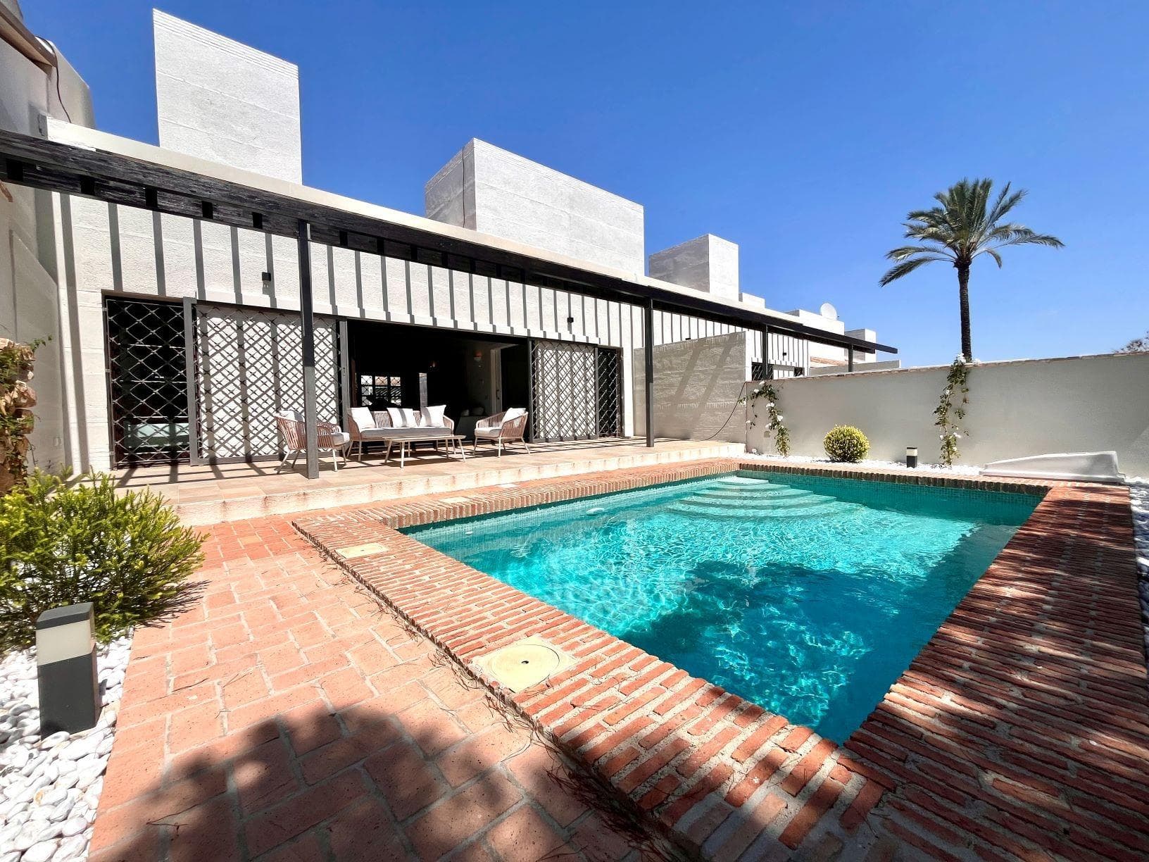 Elegant One-Level Townhouses with Private Pool in Peraleja Golf Resort – Costa Cálida&#13;&#13;Mediterranean-Style Townhouses in a Gated Golf Community&#13;Discover 11 exclusive single-storey townhouses located in the prestigious Peraleja Golf Resort, in the Murcia region of southern Spain. These modern Mediterranean homes are set on spacious plots of approximately 260 m², each offering a private pool, landscaped garden, and on-site parking. Designed with sloped ceilings and natural materials like wood and stone, these houses blend seamlessly with the surrounding landscape while offering stylish, timeless interiors.&#13;&#13;Comfortable Living with Premium Finishes&#13;Each house features:&#13;&#13;2 bedrooms and 2 bathrooms&#13;Open-plan kitchen fully furnished with appliances&#13;Bright living-dining area with a cozy wood-burning fireplace&#13;Centralized air conditioning and gas radiator heating&#13;Reinforced front door and motorized vehicle access gate&#13;Private pool (3.5x5.5 m) with outdoor shower&#13;Exterior water and lighting points&#13;Fully landscaped garden ready to enjoy&#13;&#13;These properties have been carefully designed by a renowned architect, combining elegant lines with natural textures, creating a unique and harmonious environment within a secure gated community.&#13;&#13;Life in Peraleja Golf Resort – Nature and Security&#13;The houses are located within the Peraleja Golf Resort, which features a 24-hour security gate, piano bar, and clubhouse with a gourmet restaurant. The resort is surrounded by protected natural areas where walking, jogging, and cycling circuits are being developed for residents. The 18-hole golf course, originally designed by the legendary Severiano Ballesteros, is currently under renovation and scheduled to reopen by the end of 2025. Select homes and the social club enjoy distant sea views.&#13;&#13;Convenient Location Near Beaches and Cities&#13;This peaceful resort offers excellent access to key locations:&#13;&#13;Sucina and Avileses towns – 3-5 km&#13;Mar Menor beaches – 20 km (20 min by car)&#13;Murcia city – 25 km (20 min by car)&#13;Murcia Airport (RMU) – 25 km (15 min by car)&#13;Alicante Airport (ALC) – 80 km (45 min by car)&#13;La Zenia Boulevard Shopping Center – 35 km&#13;&#13;Enjoy the Charm of Costa Cálida&#13;Located near the traditional Spanish town of Sucina, residents can enjoy local shops, restaurants, and authentic charm, while still being close to the coast and vibrant city life. This area has become increasingly popular with international buyers for its quality of life, good infrastructure, wonderful weather year round and access to nature spots and the sea.&#13;&#13;Contact us today to secure your dream villa at Peraleja Golf and start enjoying life on the Costa Cálida!&#13;