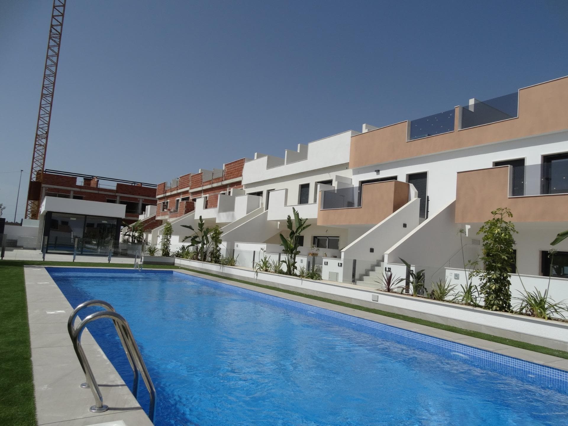 Newly Built Bungalows with Solarium or Garden in Pilar de la Horadada&#13;&#13;Modern Residential Development on the Southern Costa Blanca&#13;Located in the charming municipality of Pilar de la Horadada, this new residential development of bungalows offers a comfortable, Mediterranean lifestyle in one of the most attractive areas of the Costa Blanca. Pilar de la Horadada is known for its welcoming atmosphere, excellent climate and extensive sandy beaches such as Las Higuericas and Mil Palmeras, ideal for enjoying with the family or practising water sports.&#13;&#13;Layout and Types of Properties&#13;The complex consists of 28 modern bungalows available in 2 and 3 bedroom versions, distributed as follows:&#13;&#13;Ground floors with private garden&#13;Upper floors with private solarium and assigned storage room&#13;&#13;Many of the properties are south-facing, ensuring excellent natural light, and offer views of the communal pool or the adjacent park.&#13;&#13;Functional and well-equipped spaces&#13;Each property has been designed with spacious and functional spaces:&#13;&#13;Open-plan kitchen with large living-dining room&#13;Built-in wardrobes&#13;Private terrace in each unit&#13;Parking space included&#13;&#13;In addition, the properties feature:&#13;&#13;Hot water via aerothermal system&#13;Pre-installation of air conditioning&#13;PVC exterior carpentry with double glazing and aluminium shutters&#13;Bathroom furniture included&#13;&#13;Communal Areas and Natural Environment&#13;The residential complex includes a communal swimming pool surrounded by green areas, perfect for enjoying the sun and tranquillity. Just 4 km from Las Higuericas Beach, it can be easily reached on foot or by bike along the pleasant promenade that connects to the sea.&#13;&#13;Excellent location and connectivity&#13;The location of the residential complex allows access to all kinds of services and points of interest:&#13;&#13;Supermarkets, shops, bars and restaurants less than 1 km away&#13;Golf courses such as Lo Romero 6 km away&#13;Dos Mares shopping centre 11 km away&#13;Mil Palmeras and Torre de la Horadada beaches just 5 minutes away&#13;Murcia (Corvera) airport 40 km away&#13;Alicante Airport 65 km away&#13;&#13;Your New Life in the Sun&#13;This residential development in Pilar de la Horadada represents an excellent opportunity to enjoy Mediterranean living in a modern and well-located property.&#13;&#13;Contact us today for more information or to arrange a viewing and take the first step towards your new home on the Costa Blanca.&#13;