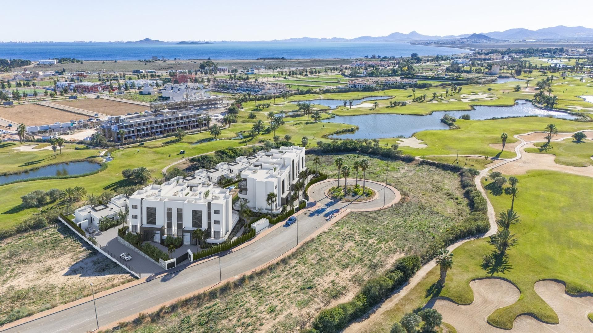 New Build Residential on the Frontline of La Serena Golf in Los Alcázares&#13;&#13;Modern Golf-Front Apartments and Villas in Costa Cálida&#13;Located in Los Alcázares, a charming coastal town in the Region of Murcia, this new build residential offers a premium lifestyle in direct contact with nature and the golf course. The development is situated in La Serena Golf, an 18-hole course known for its flat terrain, scenic lakes, and technical challenges brought by the prevailing Levante wind.&#13;&#13;This exclusive residential complex features 30 modern apartments and 10 single-storey villas, all designed for maximum comfort and style, with panoramic views of the golf course and the surrounding landscapes. Just 1.7 km from the beach and the town centre, the development offers a peaceful and well-connected setting.&#13;&#13;Distances to key points of interest:&#13;Murcia International Airport: 35 km&#13;Alicante Airport: 95 km&#13;Dos Mares Shopping Centre: 15 km&#13;Puerto Deportivo Los Alcázares: 2 km&#13;Roda Golf: 4 km&#13;Cartagena city centre: 25 km&#13;&#13;Elegant Apartments with Spacious Terraces or Penthouses with Private Solariums&#13;The apartment blocks offer homes with 2 or 3 bedrooms, available on ground and middle floors with large terraces or as penthouses with private solariums. Each apartment includes access to a communal Mediterranean-style garden and a large swimming pool, perfect for relaxation and socializing under the sun. Parking spaces in an underground garage and elevators in each block add to the convenience.&#13;&#13;Exclusive One-Level Villas with Private Pools&#13;The 10 detached villas feature 3 bedrooms, 2 bathrooms and one toilet, all on one level, designed for seamless indoor-outdoor living. Each villa includes a private swimming pool, a garden, a storage room, and private parking. Their location right on the first line of the golf course offers unobstructed views.&#13;&#13;High-Quality Finishes and Energy-Efficient Design&#13;All homes include:&#13;&#13;Aluminium exterior carpentry with thermal break and motorized shutters&#13;LED lighting and black design switches throughout&#13;Fitted bathrooms with resin shower trays and glass screens&#13;Pre-installed ducted air conditioning&#13;Elevators in apartment blocks&#13;Storage rooms in villas&#13;Modern kitchen and open-plan living areas&#13;&#13;Live by the Sea and the Green&#13;This development is ideal for golf lovers, beach enthusiasts, and anyone looking for a serene lifestyle on the Costa Cálida. With modern architecture, excellent amenities, and unbeatable surroundings, these homes are perfect for both permanent living and investment.&#13;&#13;Contact us today to schedule your visit and discover your future home in Los Alcázares.&#13;