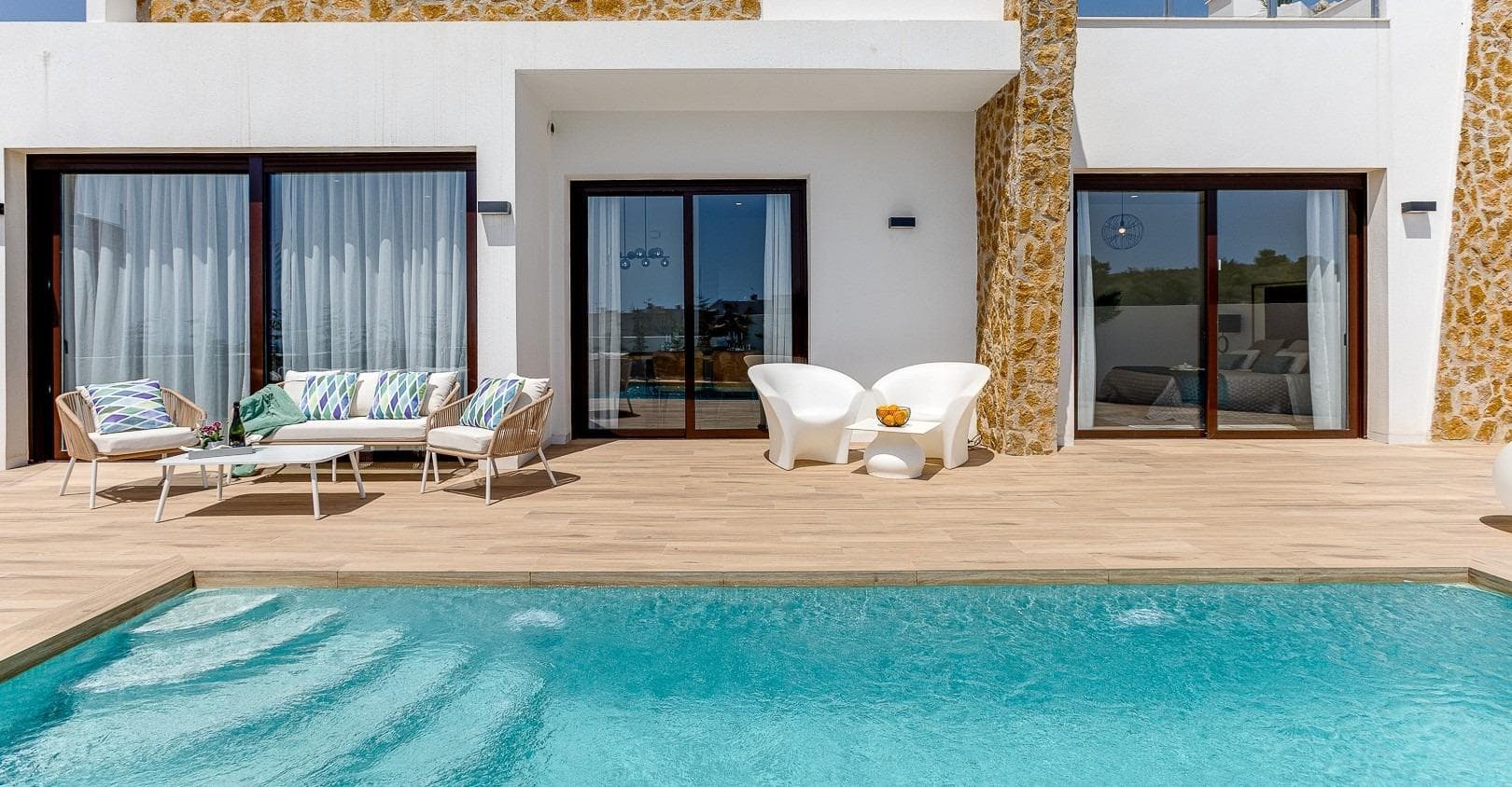 NEW BUILD VILLAS IN BALCON DE FINESTRAT&#13;&#13; New Build modern villas in Balcon de Finestrat.&#13;&#13;Wide and bright villas with 3 bedrooms and 2 bathrooms, open plan kitchen with living-dining area, beautiful terrace, private garden with the pool and parking space.&#13;&#13;Combination of wood and natural stone makes the house modern and rustic at the same time.&#13;&#13;Villas located 10 minutes from Benidorm and only 2 km from Finestrat. The ride to Tierra Mitica where you can spend nice time with family will take 6 minutes. This location makes it a great choice for a holiday home.&#13;&#13;Finestrat located in the Marina Baixa region of the Costa Blanca, close to neighbouring Benidorm and about 40 kilometres from the city of Alicante and the international airport. &#13;&#13;The village is situated on the mountainside of Puig Campana and offers beautiful views of the mountains, the coast and the Mediterranean Sea.&#13;&#13;Benidorm is just a five-minute drive from the properties and offers all the services you would need including shops, bars, restaurants, supermarkets, banks, pharmacies and several private international schools.&#13;&#13;Close to the beaches of Levante, Poniente and Cala de Finestrat, with more than 6km in length that are among the best in Europe awarded by the European Union with Blue Flags.&#13;&#13;All leisure services such as the theme parks of Aqua Natura, Terra Mítica, Terra Natura, Aqualandia and Mundomar, Sierra Cortina and Villaitana Golf courses, hiking and climbing in Puig Campana an incomparable natural setting or enjoy of nautical sports.&#13;&#13;