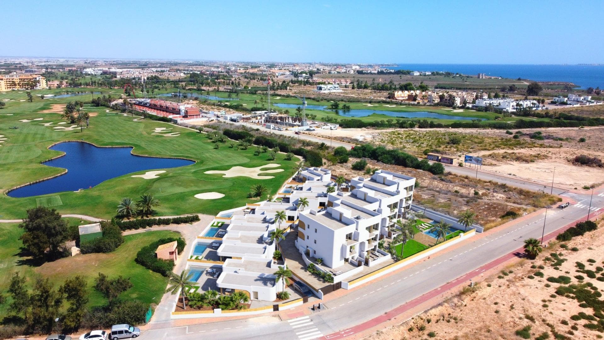New Build Residential Complex in Los Alcázares on the Frontline of Serena GolfExclusive Living on the Costa CálidaDiscover this new residential development in Los Alcázares, perfectly located on the frontline of Serena Golf and just 1.3 km from the beaches of the Mar Menor. Nestled in the heart of the Costa Cálida, this project combines modern architecture, comfort, and exceptional surroundings. With excellent road connections, the complex is only 30 km from Murcia Airport (25 minutes) and 90 km from Alicante Airport (55 minutes), offering easy access to Cartagena, Murcia, and the Costa Blanca.Contemporary Homes with Exceptional DesignThe residential complex includes 18 elegant apartments and 7 exclusive villas, each designed to maximize space, light, and functionality. Residents will enjoy breathtaking views of the golf course and, from the upper floors, the sparkling waters of the Mar Menor.Choose from:Apartments with 2 or 3 bedrooms and 2 bathrooms, all with dual orientation and two terraces for all-day sunlight.Ground-floor apartments with private gardens.Middle-floor units with large terraces.Penthouses with two terraces, private solarium, and panoramic views.Detached villas on the frontline of golf, with 3 bedrooms, 2 bathrooms, basement, solarium, and private pool.Premium Features and AmenitiesEvery home is equipped with high-quality finishes and modern comforts, including:Parking space and storage roomAerothermal hot water systemPre-installed ducted air conditioningElectric shutters and full lighting packageFully fitted bathrooms with furniture and shower screensCommunal swimming pool and landscaped gardensElevator in the apartment blocksPerfect Location for Golf and Beach LoversSituated in a privileged enclave, the development is surrounded by the peaceful greenery of Serena Golf and lies just a short walk from the warm, shallow waters of the Mar Menor. This unique area offers year-round opportunities for swimming, sailing, paddleboarding, and other water sports, making it ideal for both relaxation and activity.Key distances:Beach (Mar Menor): 1.3 kmSerena Golf: Adjacent to the complexLos Alcázares town center: 2 kmCartagena: 22 kmMurcia city: 40 kmMurcia Airport: 30 km (25 minutes)Alicante Airport: 90 km (55 minutes)Secure Your Mediterranean LifestyleThis development in Los Alcázares offers the perfect combination of beach, golf, and modern living. Whether as a permanent residence, holiday retreat, or investment, it provides everything needed for an authentic Mediterranean lifestyle.Contact us today to arrange a visit and secure your new home on the Costa Cálida.