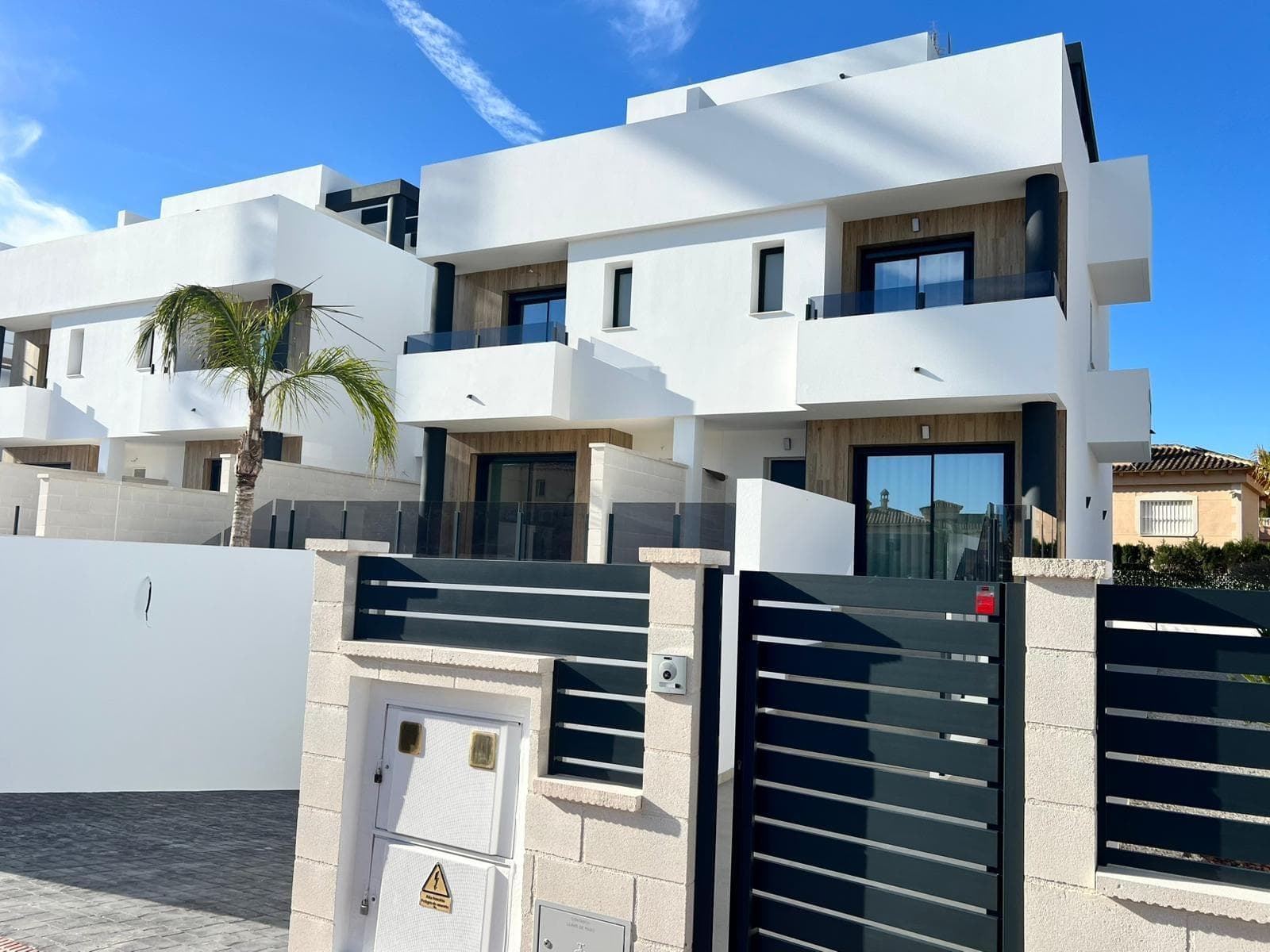 Modern New Build Semi Detached Villas in Benferri AlicanteExclusive New Development in Benfis ParkDiscover this new promotion of 10 modern semi detached villas located in Benfis Park, Benferri, in the heart of the Vega Baja region of Alicante. This charming town offers a peaceful residential atmosphere with well kept streets and a welcoming community, ideal for families, retirees or anyone seeking a relaxed lifestyle under the Mediterranean sun. Benferri combines rural charm with excellent access to nearby towns, beaches and major transport links.Spacious Villas with Private SolariumEach villa offers a total built area of 222 sqm and is distributed over three floors plus a private solarium. The basement level includes a garage with space for two cars and a storage room. The ground floor features a bright open plan living and dining area with a modern kitchen, a laundry room and a guest toilet, with direct access to a terrace that surrounds the home. On the first floor there are three bedrooms and two bathrooms, one of them ensuite, as well as two terraces serving two of the bedrooms. The top floor offers a private solarium of approximately 39 sqm, perfect for sunbathing, outdoor dining or relaxing with open views.Modern Features and Optional PoolThe villas come with a fully fitted kitchen including electrical appliances, and pre installation for ducted air conditioning. A private swimming pool is available as an optional extra, allowing buyers to further personalize their home. The design focuses on comfort, functionality and natural light, creating a contemporary living environment ideal for year round living or holiday use.Living in Benferri Vega BajaBenferri is located just a few minutes from Orihuela and benefits from quick access to the AP 7 motorway, making travel to the Costa Blanca beaches, Alicante Elche Airport and the main shopping and leisure areas fast and convenient. The surrounding landscape is characterized by fertile farmland, gentle hills and Mediterranean scenery, offering a sense of wellbeing and connection to nature. The town provides all essential services including supermarkets, schools, sports facilities and a lively local atmosphere throughout the year.Distances to Points of InterestOrihuela 8 kmGuardamar del Segura beach 25 kmLa Finca Golf Resort 18 kmVistabella Golf 14 kmAlicante Elche Airport 45 kmPort of Torrevieja 32 kmShopping center Zenia Boulevard 30 kmYour New Home in the Costa BlancaThese new build semi detached villas in Benferri offer generous space, modern design and a strategic location close to beaches, golf courses and key services. Contact us today to receive more information or arrange your private viewing.