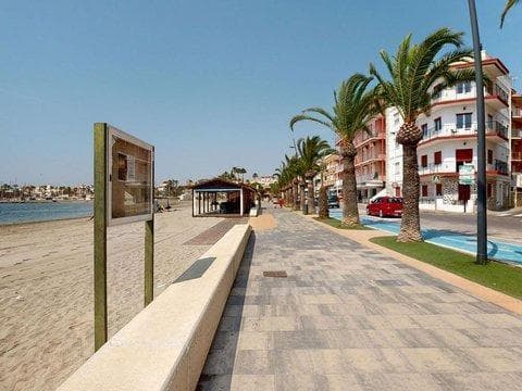 Just 200 meters from Villananitos Beach in Lo Pagán (San Pedro del Pinatar), lies this magnificent apartment, ideal for year-round living or as an investment in one of the most sought-after areas of the Mar Menor. The apartment features a large, fully furnished and equipped separate kitchen, which can be opened up to the living room to create an even more modern and functional space. The very spacious, corner living-dining room is bright thanks to its large windows. The apartment also has a full bathroom for both home and guest use. The apartment offers two double bedrooms, one with a dressing room and en-suite bathroom, providing maximum comfort and privacy. Located close to all amenities, shops, restaurants, and entertainment areas, it is perfect for both a seaside holiday or a permanent residence. It includes a 20 m² storage room, directly accessible from the elevator, ideal for storing bicycles, beach equipment, and much more. A unique opportunity to enjoy the Mediterranean lifestyle, in an unbeatable location just steps from the sea. * The indicated retail price does not include taxes or title deed fees. * The surface areas indicated on this page are descriptive and approximate; therefore, they have no contractual or binding value. Prices are subject to change without prior notice.