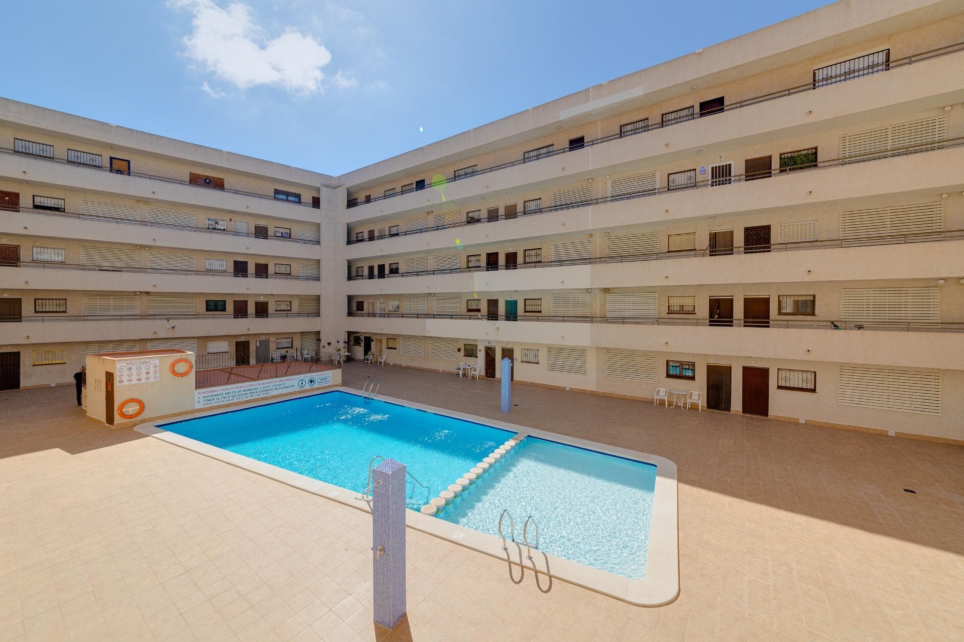 This spacious apartment is located right in the center of Torrevieja, near the bus station and just 500 meters from the popular Playa del Cura. A privileged area, surrounded by all the essential services for daily life: supermarkets, pharmacies, shops, restaurants, medical centers, and public transport. Situated on the first floor with completely open views, this home stands out for its brightness and natural ventilation. Thanks to its double orientation (south and east), each room receives abundant natural light throughout the day, creating a warm, comfortable, and very pleasant atmosphere. The property offers a functional and comfortable layout: a large living-dining room with direct access to two terraces, ideal for enjoying the Mediterranean climate. Three double bedrooms, one of them with a private dressing room and en-suite bathroom, perfect for families or those needing extra space. A second full, independent bathroom. And a fully equipped separate kitchen with access to a large enclosed gallery offering a practical laundry and storage area. If you're looking for a spacious, central home with terraces and close to the sea, this is your opportunity. Contact us for more information or to arrange a visit. We’ll be happy to help you find your new home on the coast.